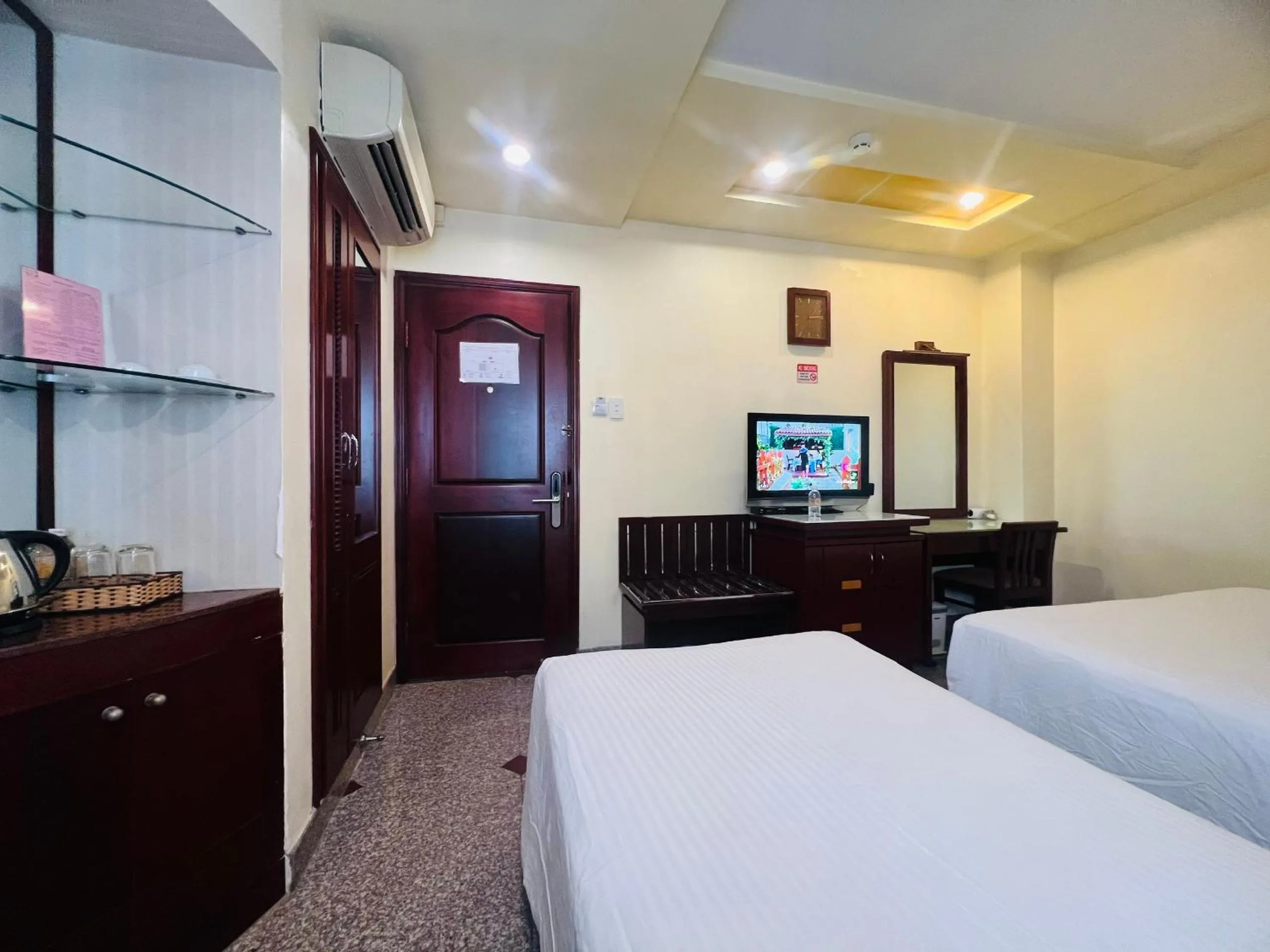 Bed in LUCASTA SAIGON Hotel