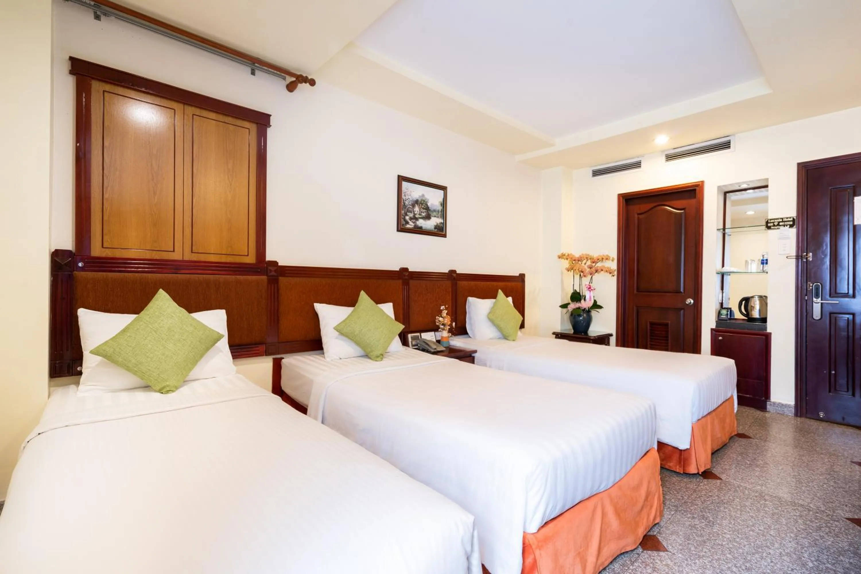 Bed in LUCASTA SAIGON Hotel