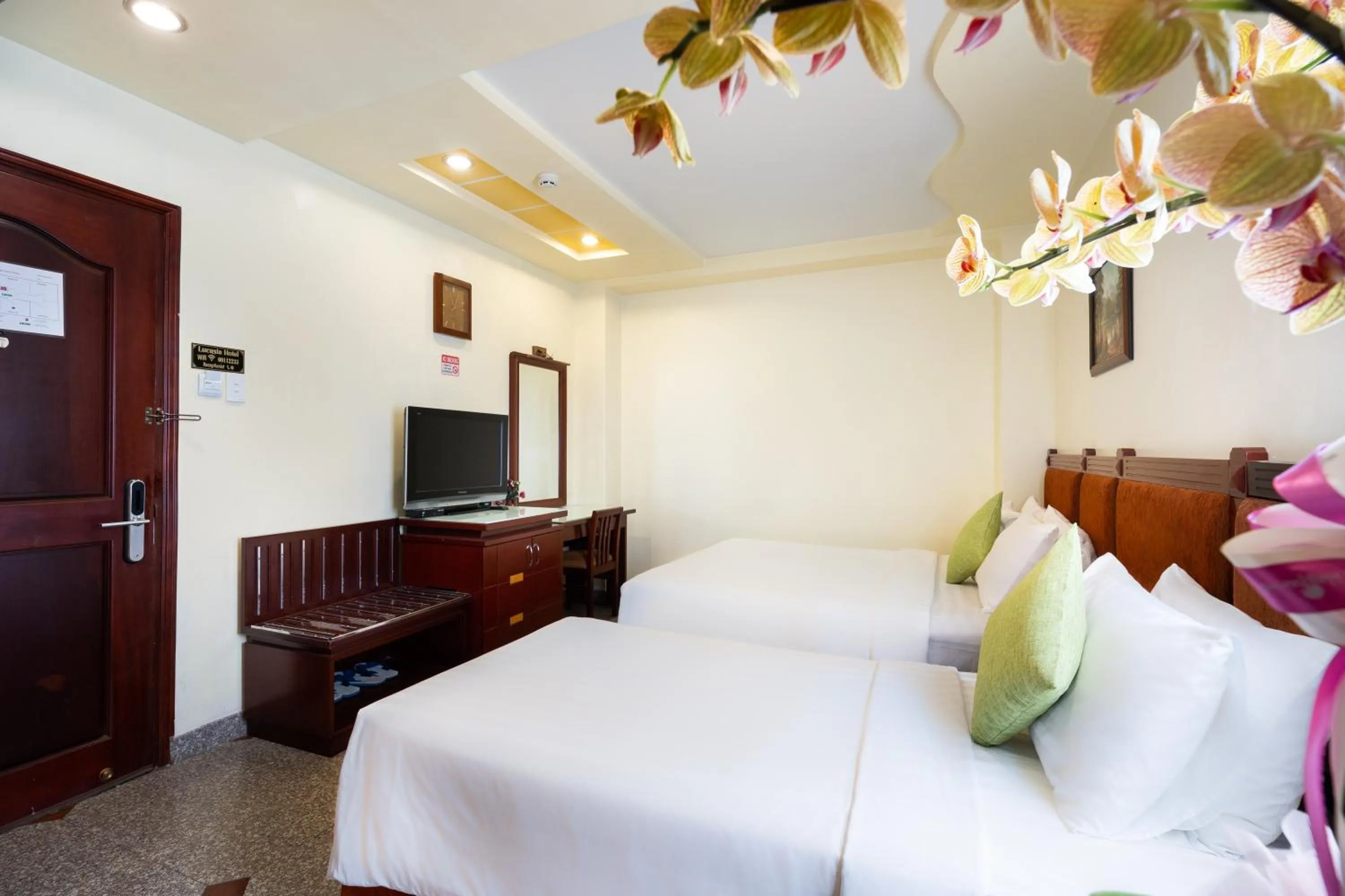 Communal lounge/ TV room, Bed in LUCASTA SAIGON Hotel