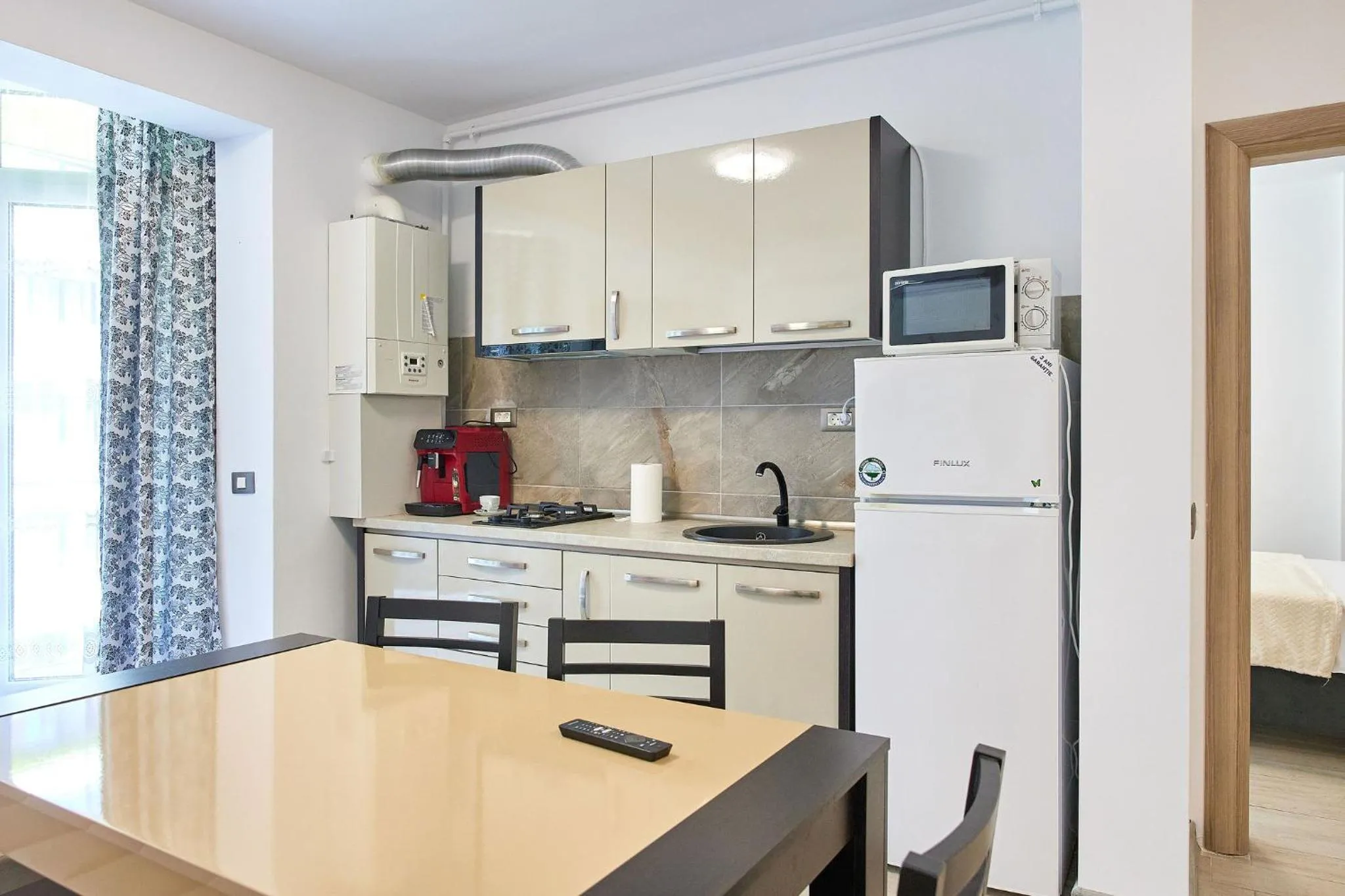 Kitchen or kitchenette in Apartamente Miramare by Alz