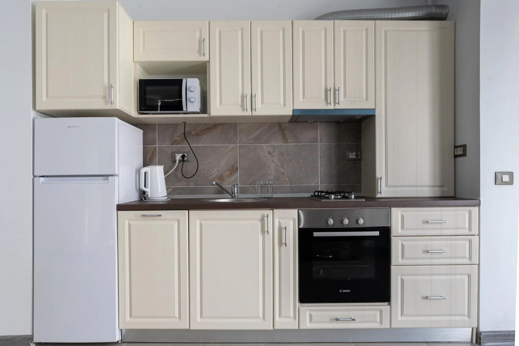 Kitchen or kitchenette in Apartamente Miramare by Alz
