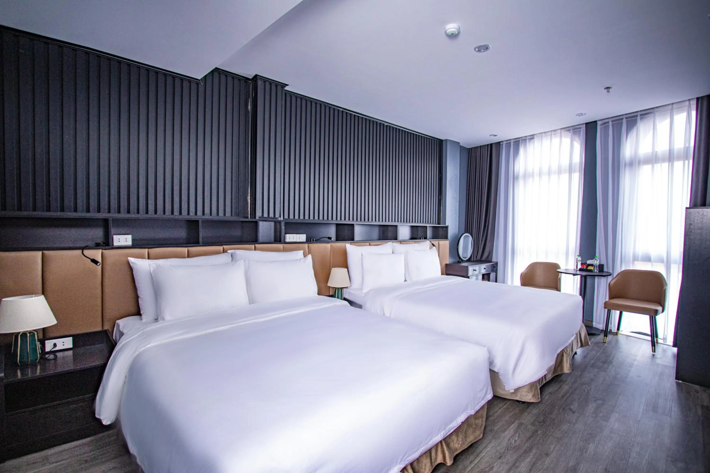 Bed in La Maison Boutique Hotel