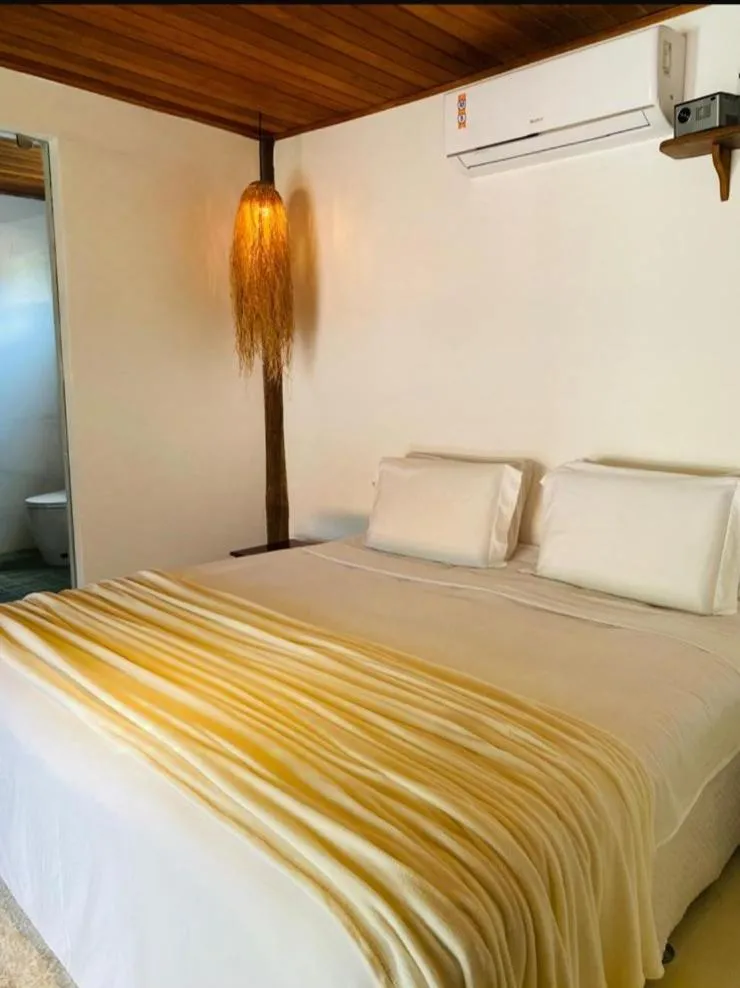 Bed in Pousada Casa da Praia