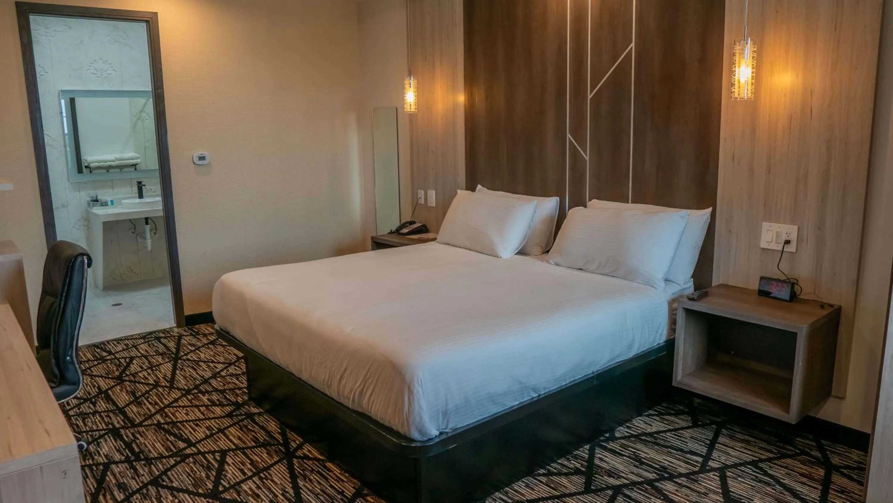 Bedroom, Bed in Comfeeni Inn and Suites