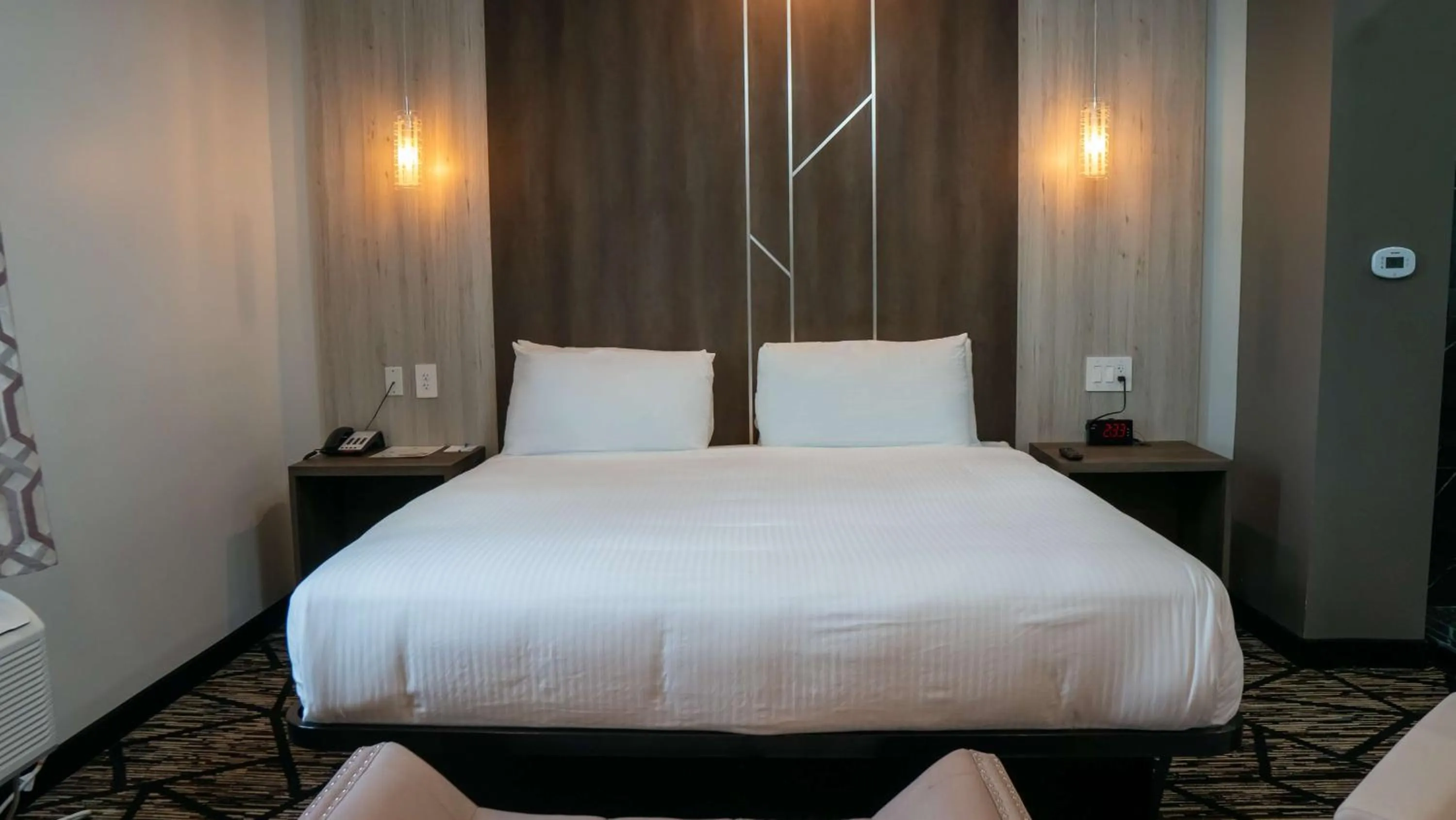 Bedroom, Bed in Comfeeni Inn and Suites