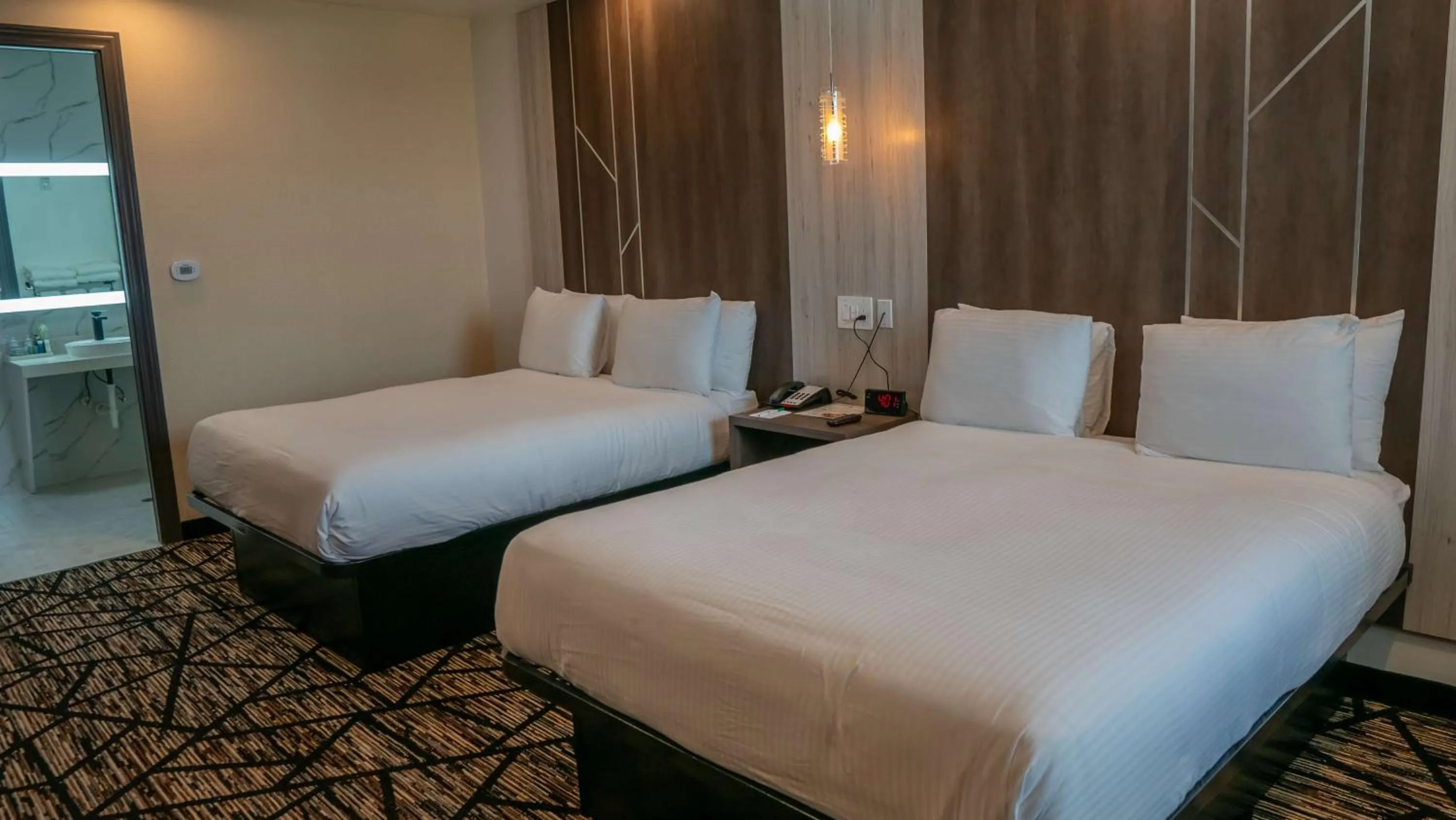 Bedroom, Bed in Comfeeni Inn and Suites