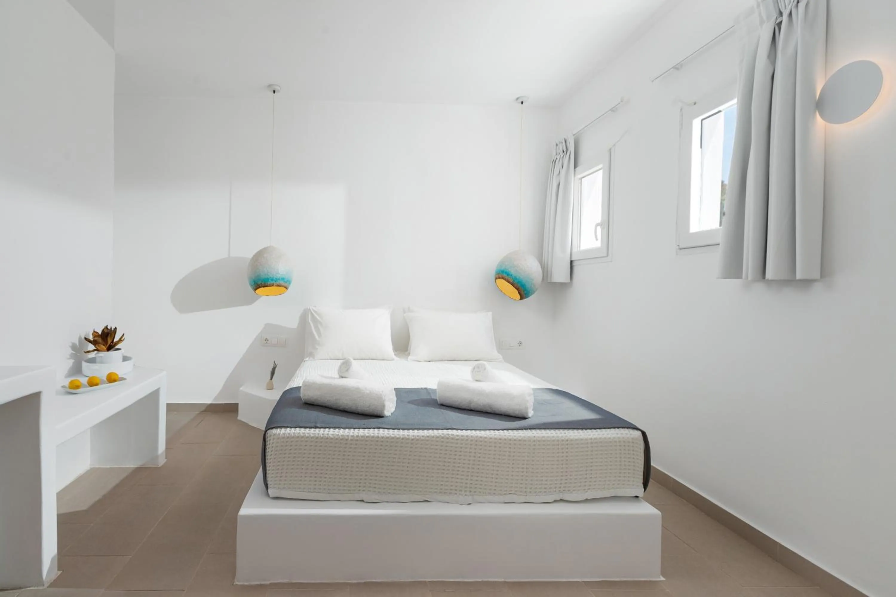 Bed in VOCA HOTEL & SUITES