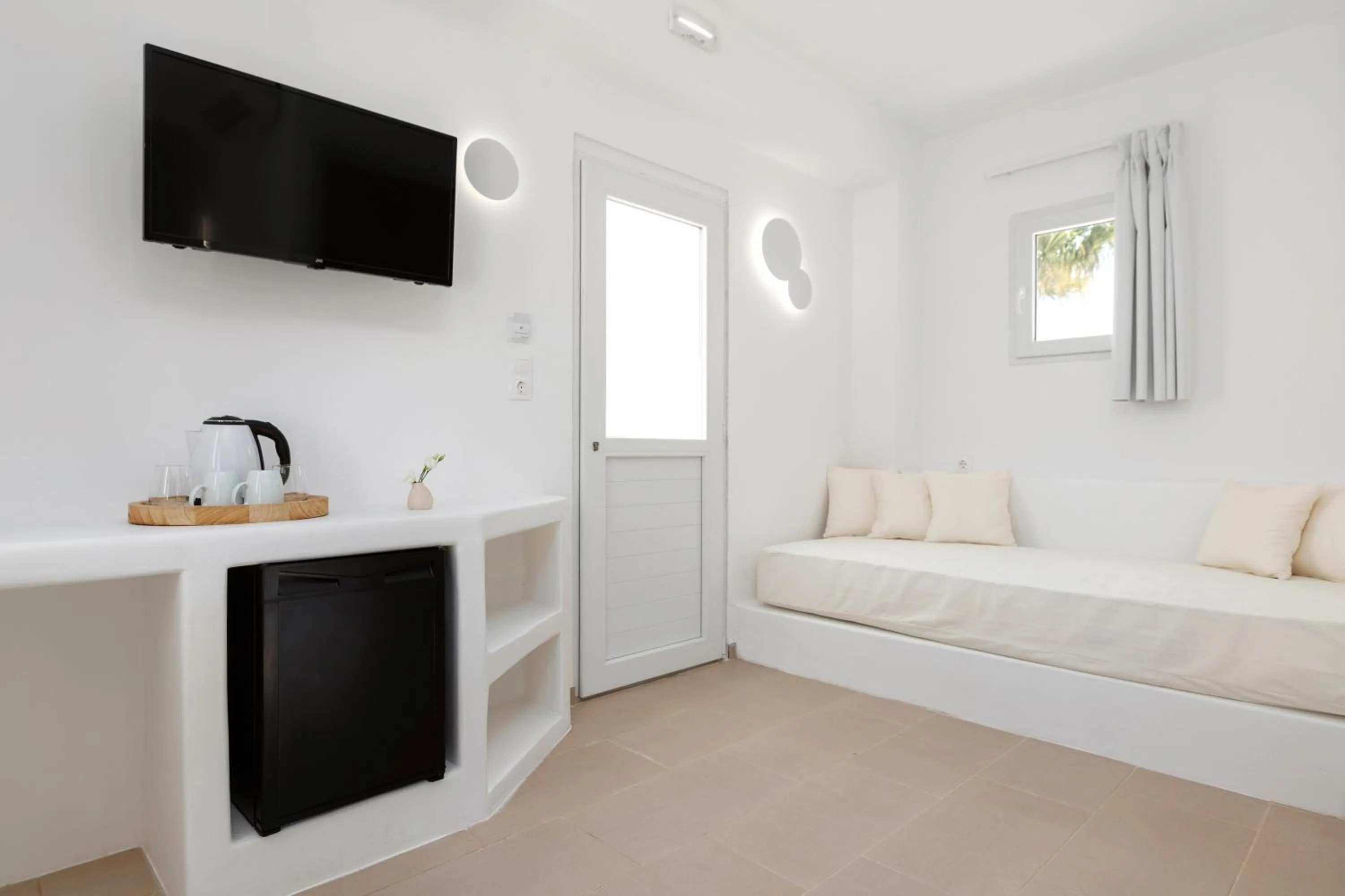 Bed in VOCA HOTEL & SUITES