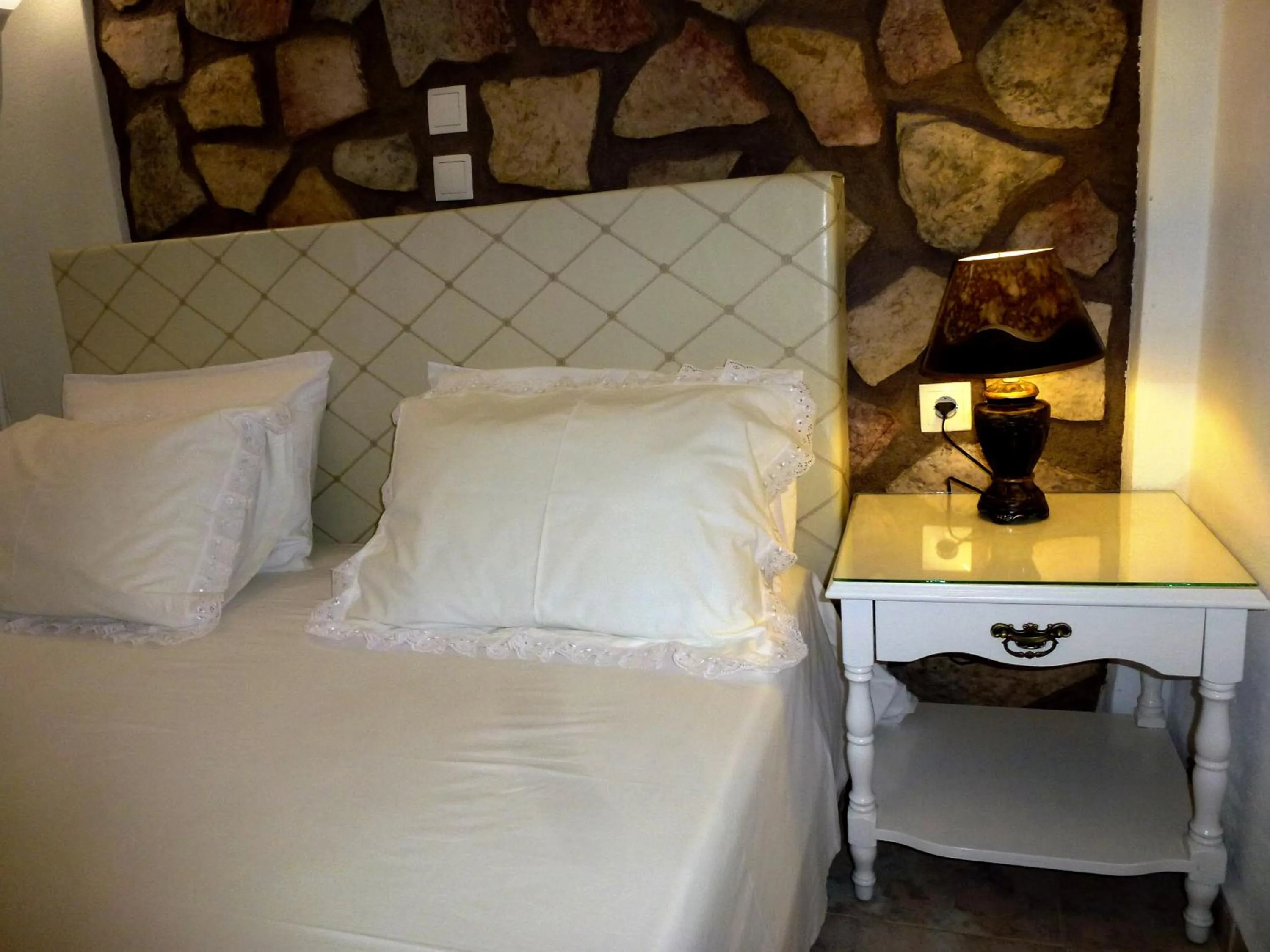 Bed in Atalos Suites
