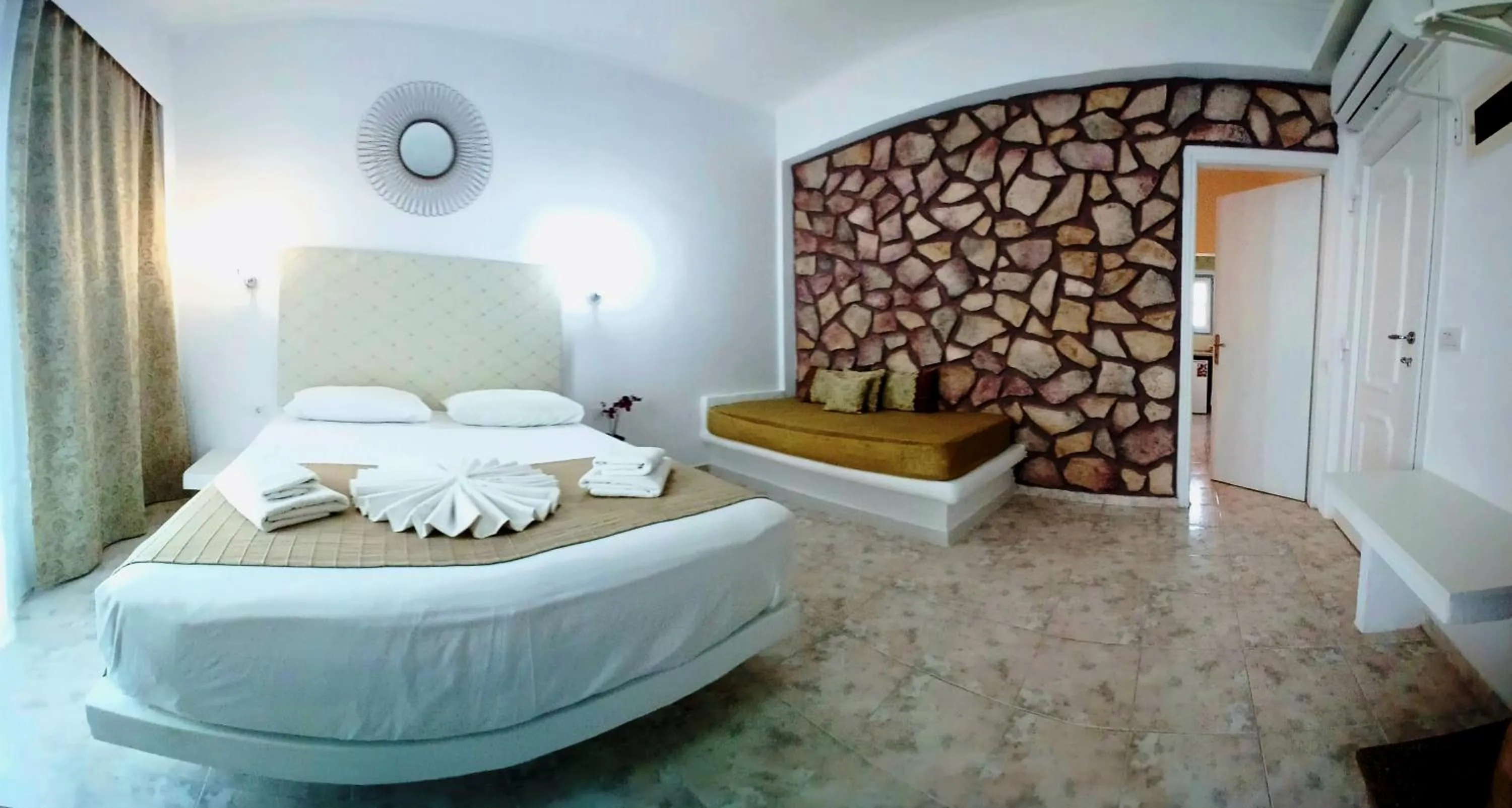 Bed in Atalos Suites