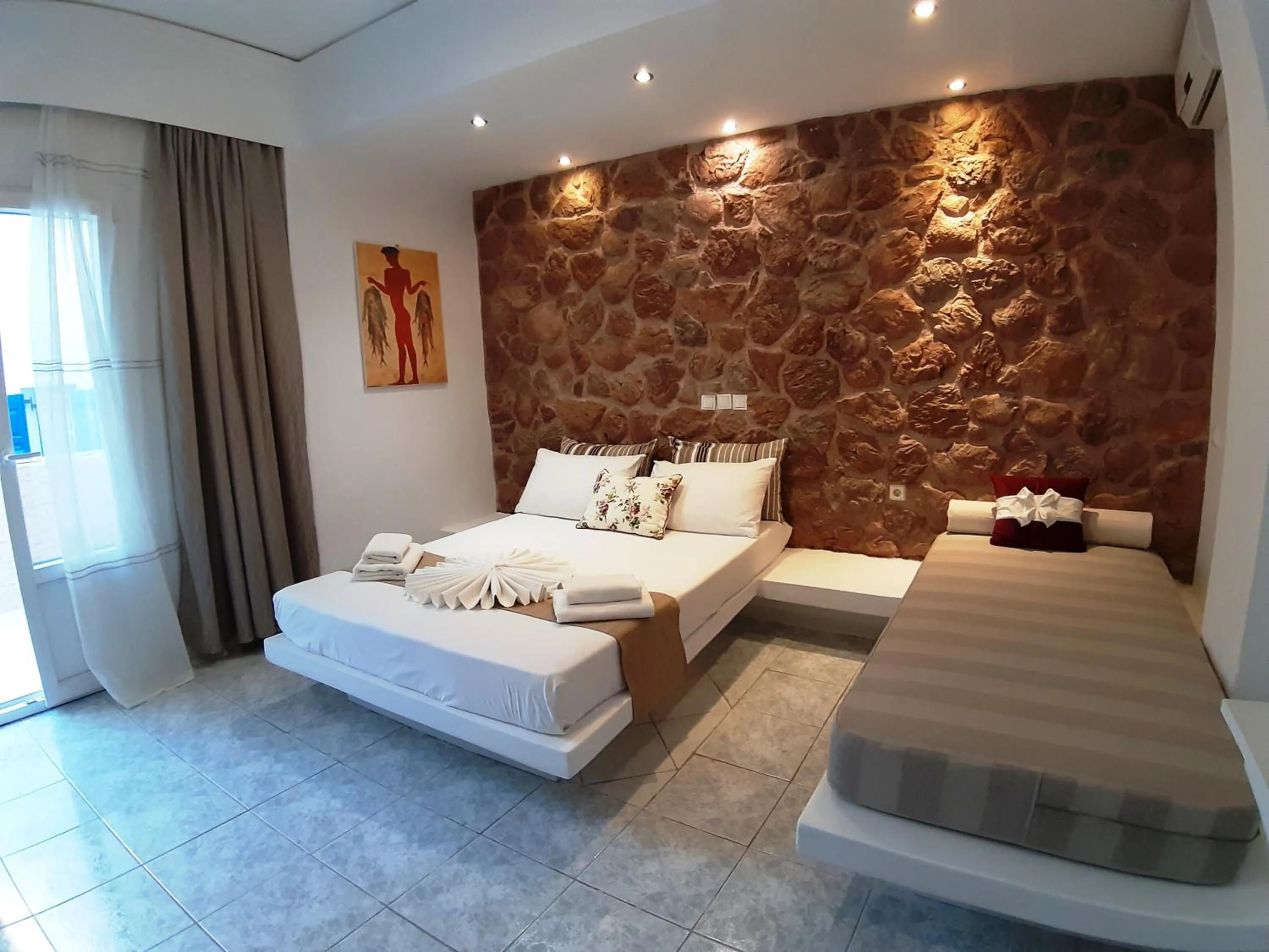 Bed in Atalos Suites