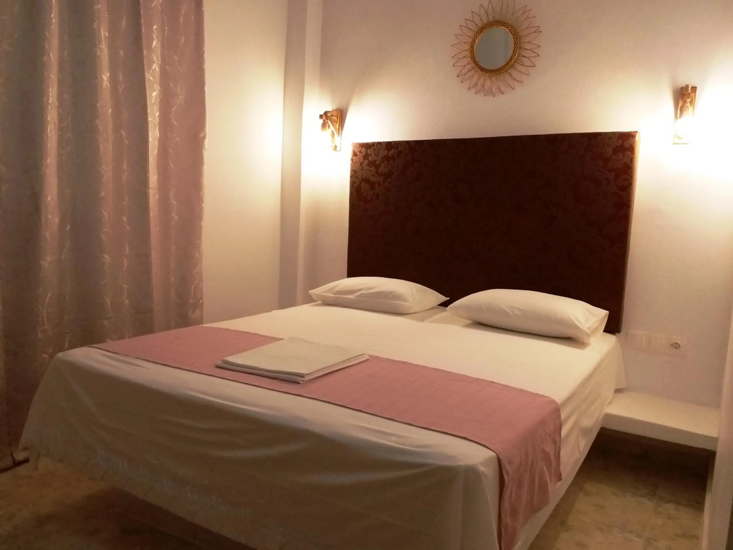 Bed in Atalos Suites