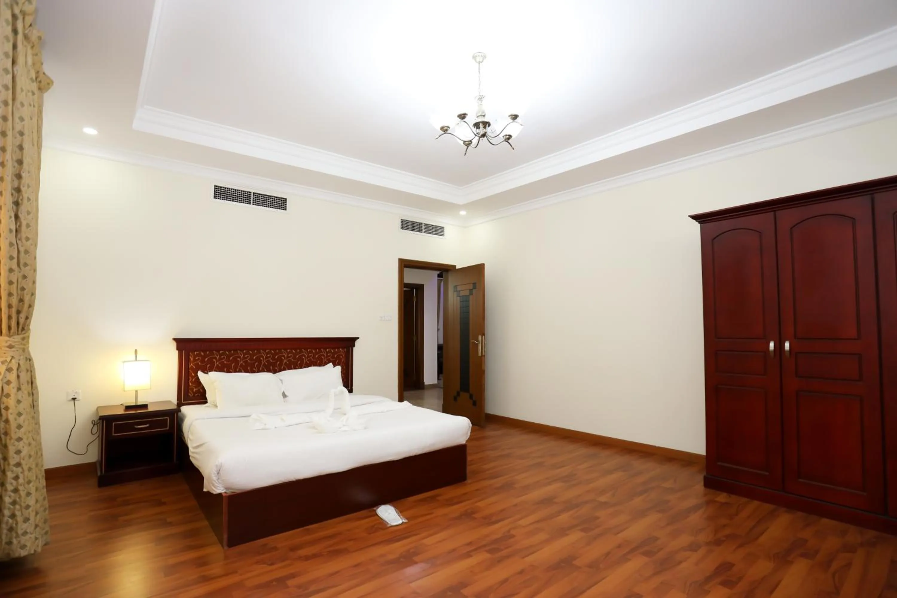 Bed in Pearl Bahrain Suites