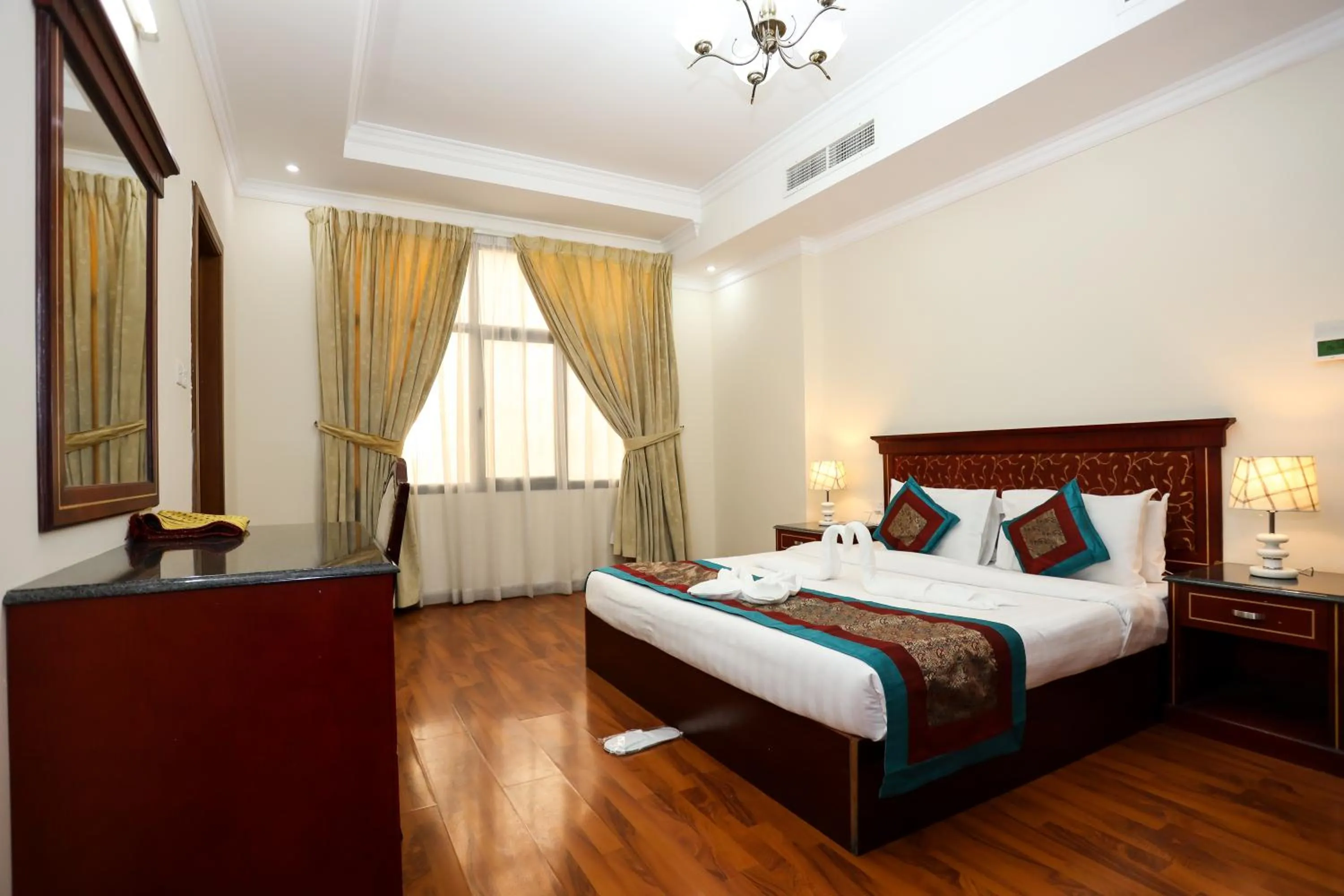 Bed in Pearl Bahrain Suites