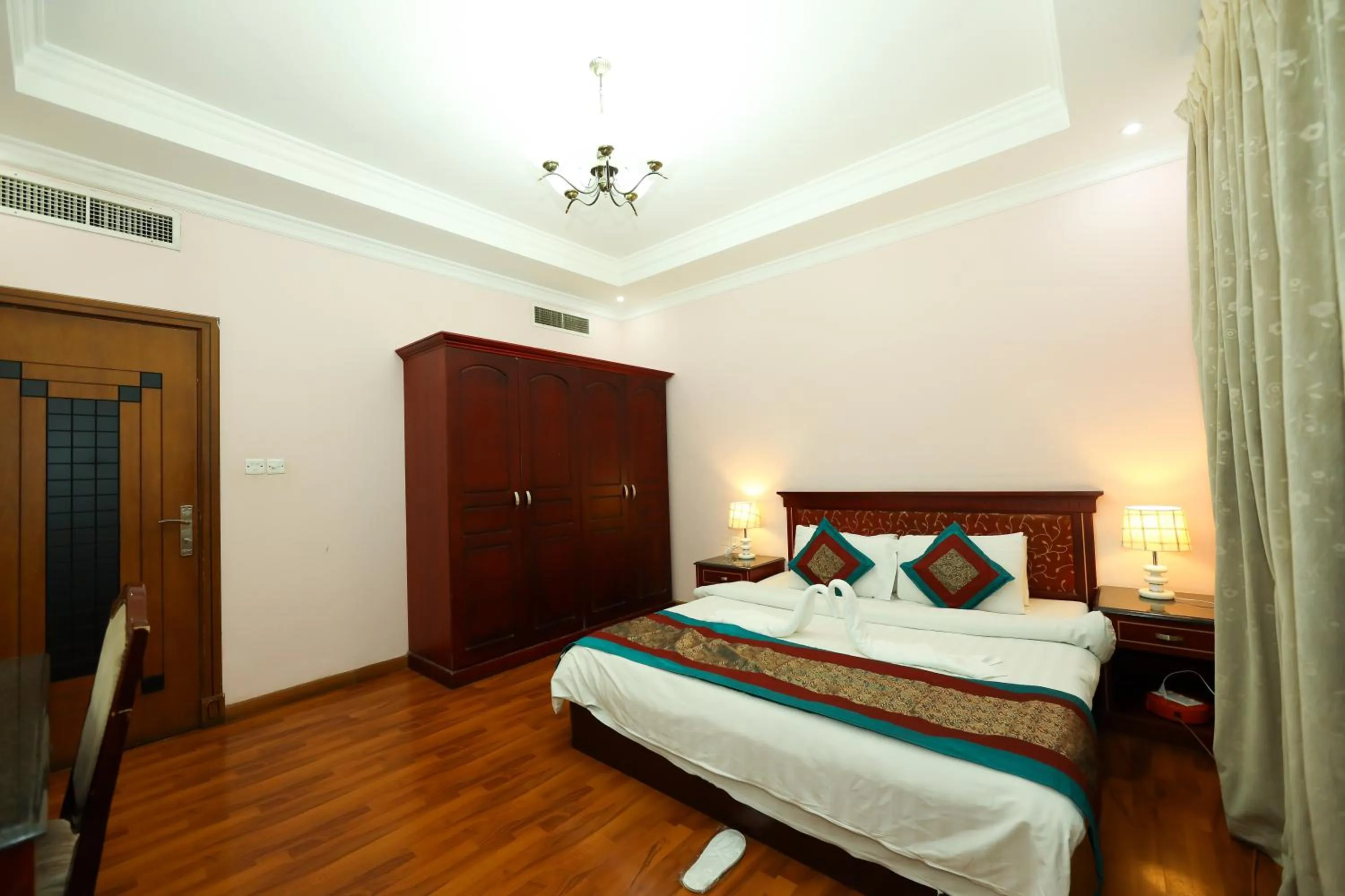 Bed in Pearl Bahrain Suites