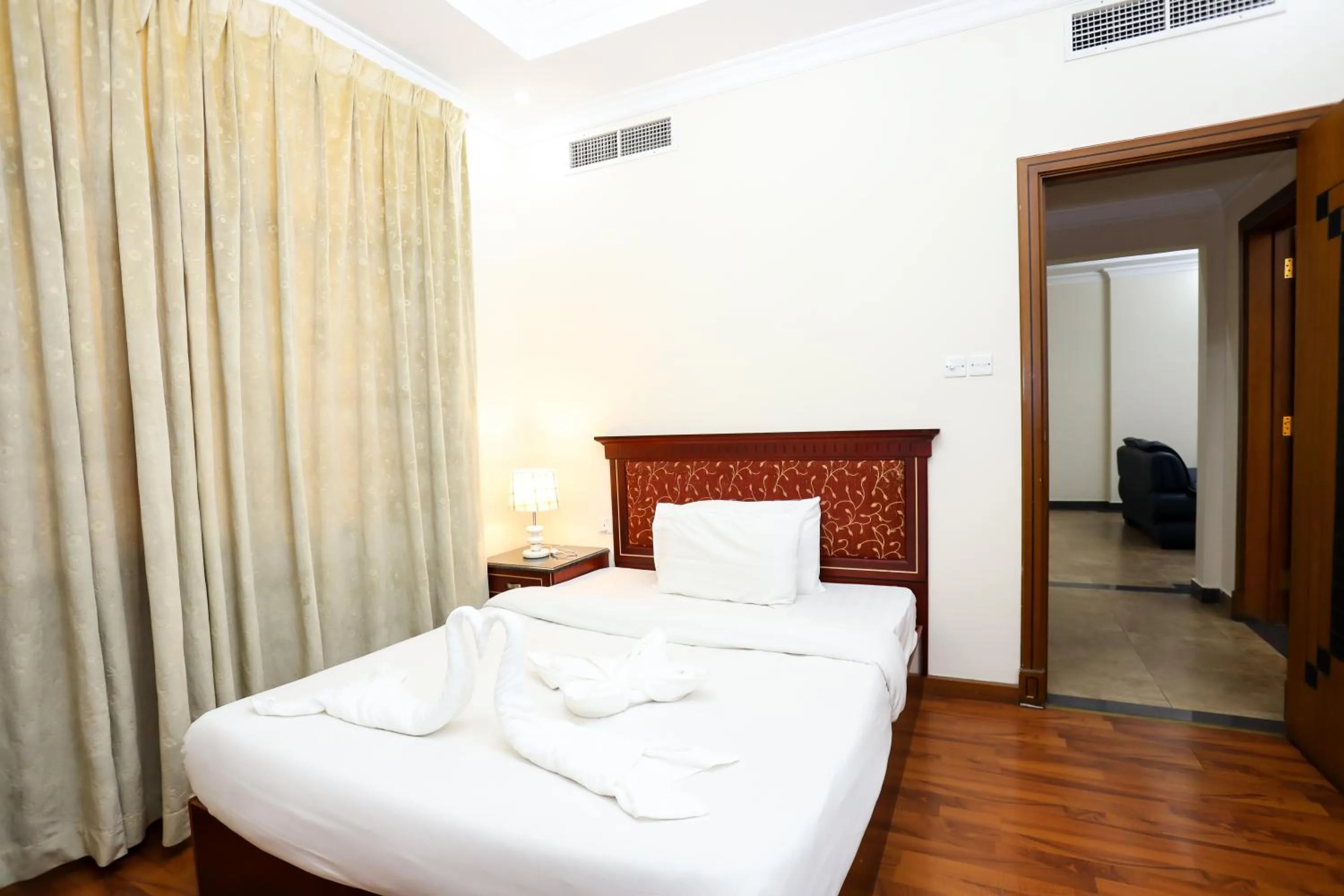 Bed in Pearl Bahrain Suites