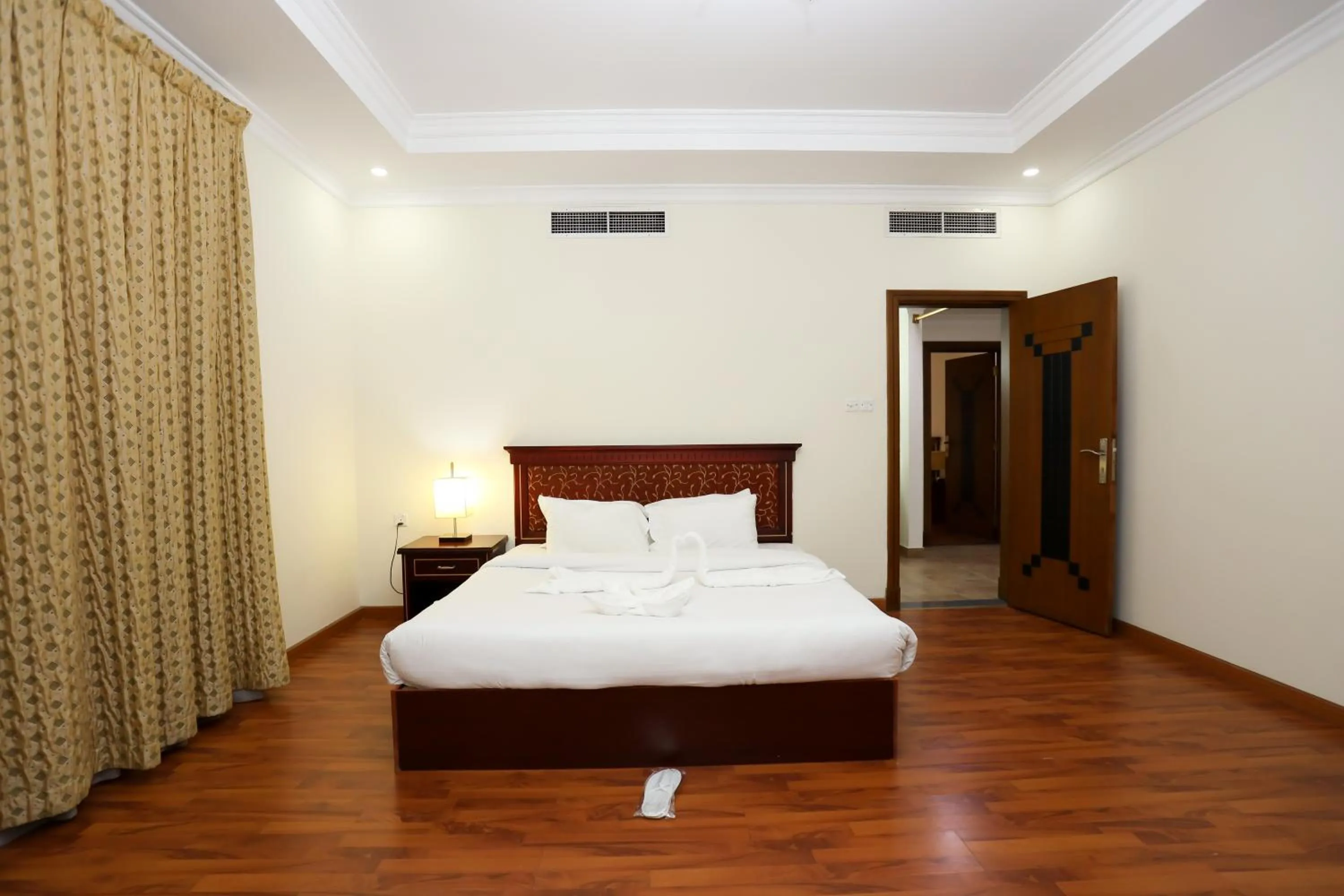 Bed in Pearl Bahrain Suites