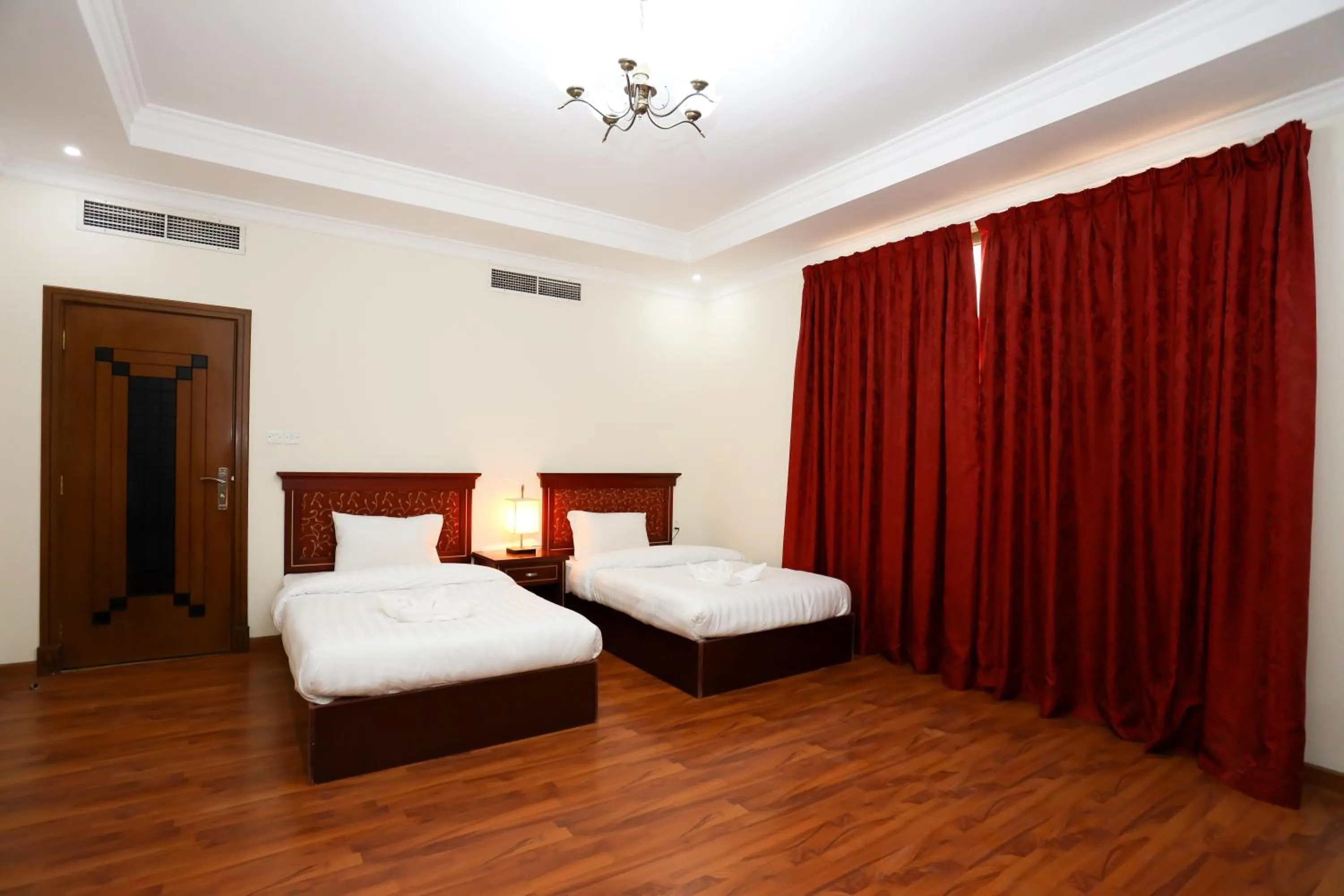 Bed in Pearl Bahrain Suites