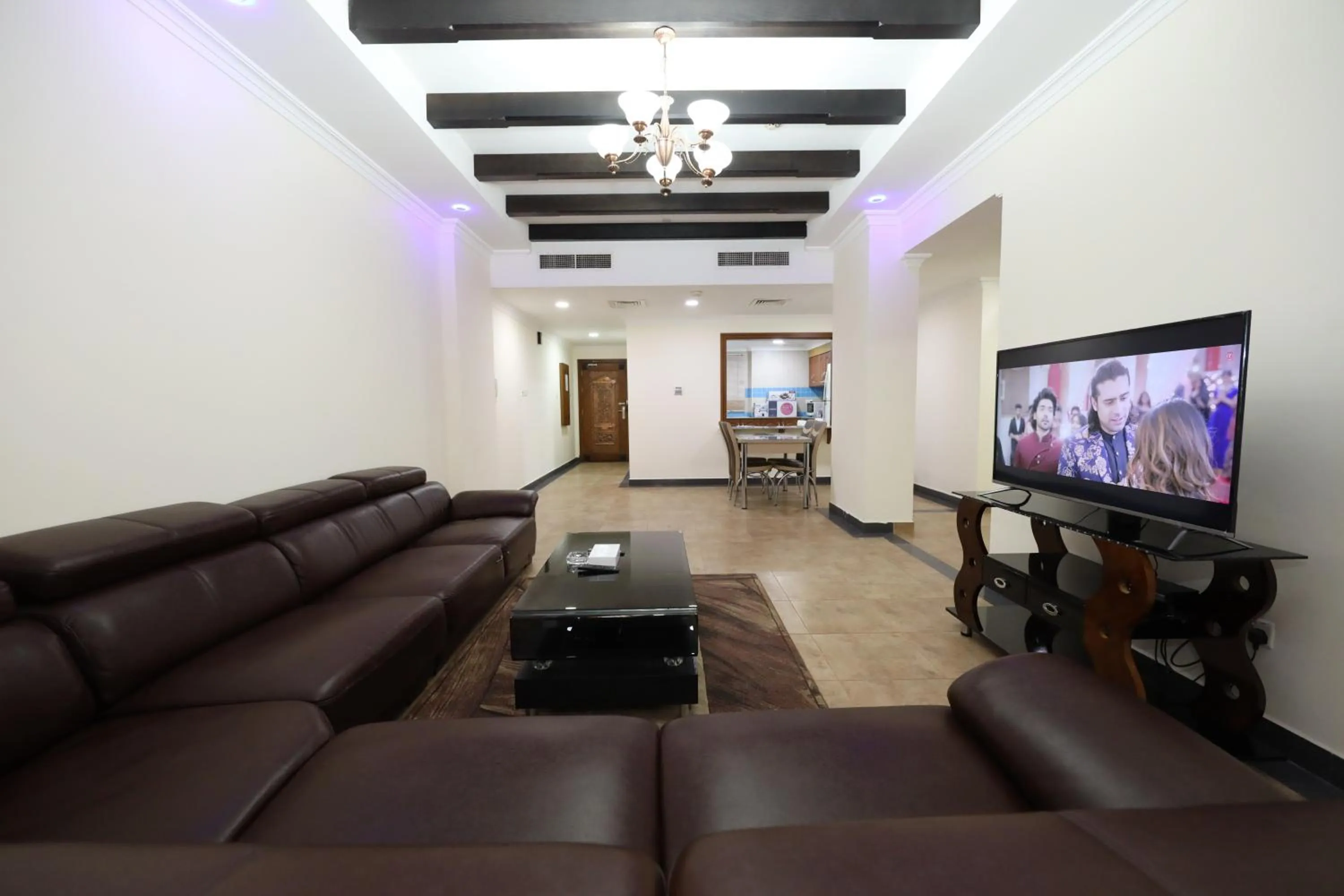 Communal lounge/ TV room in Pearl Bahrain Suites
