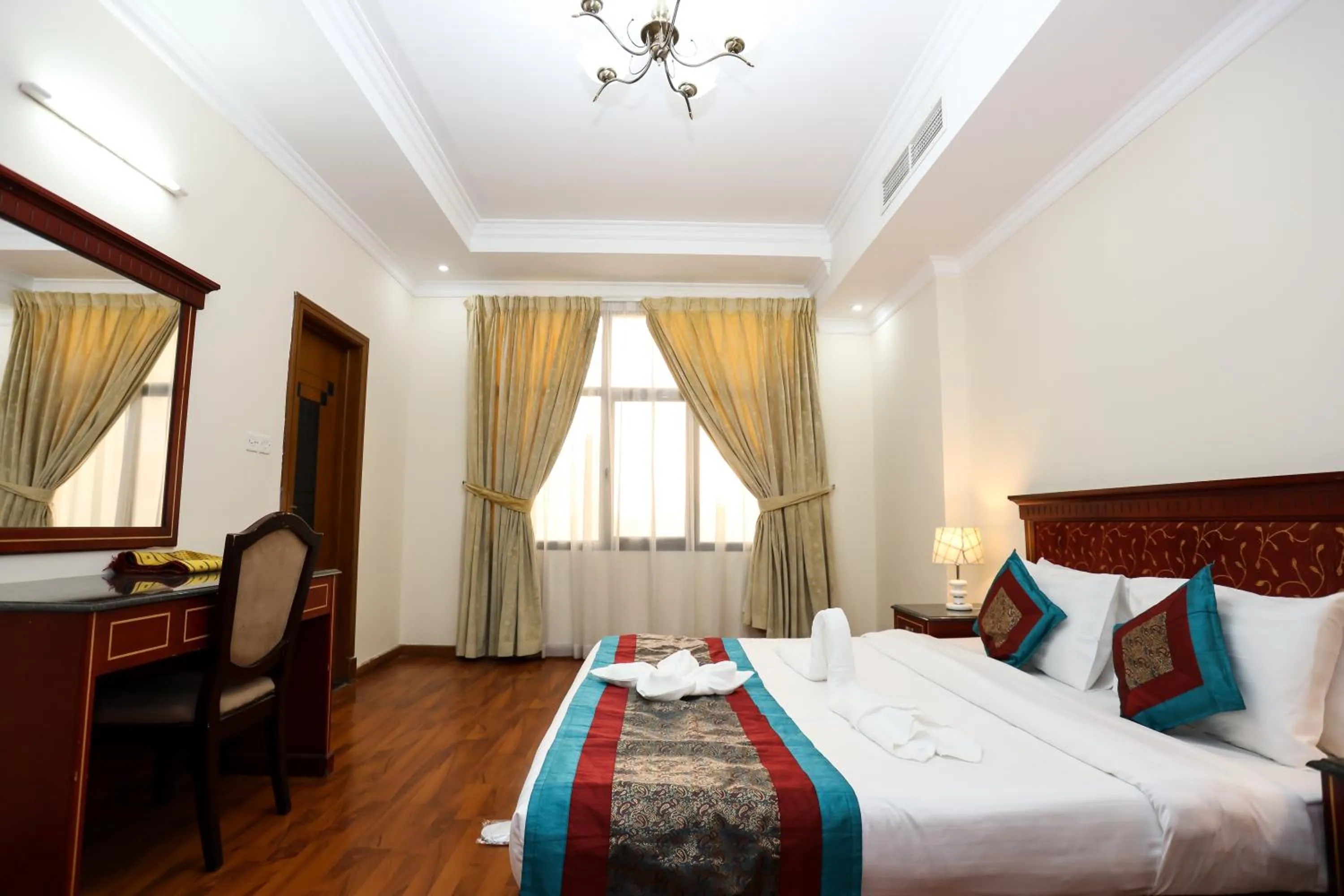 Bed in Pearl Bahrain Suites