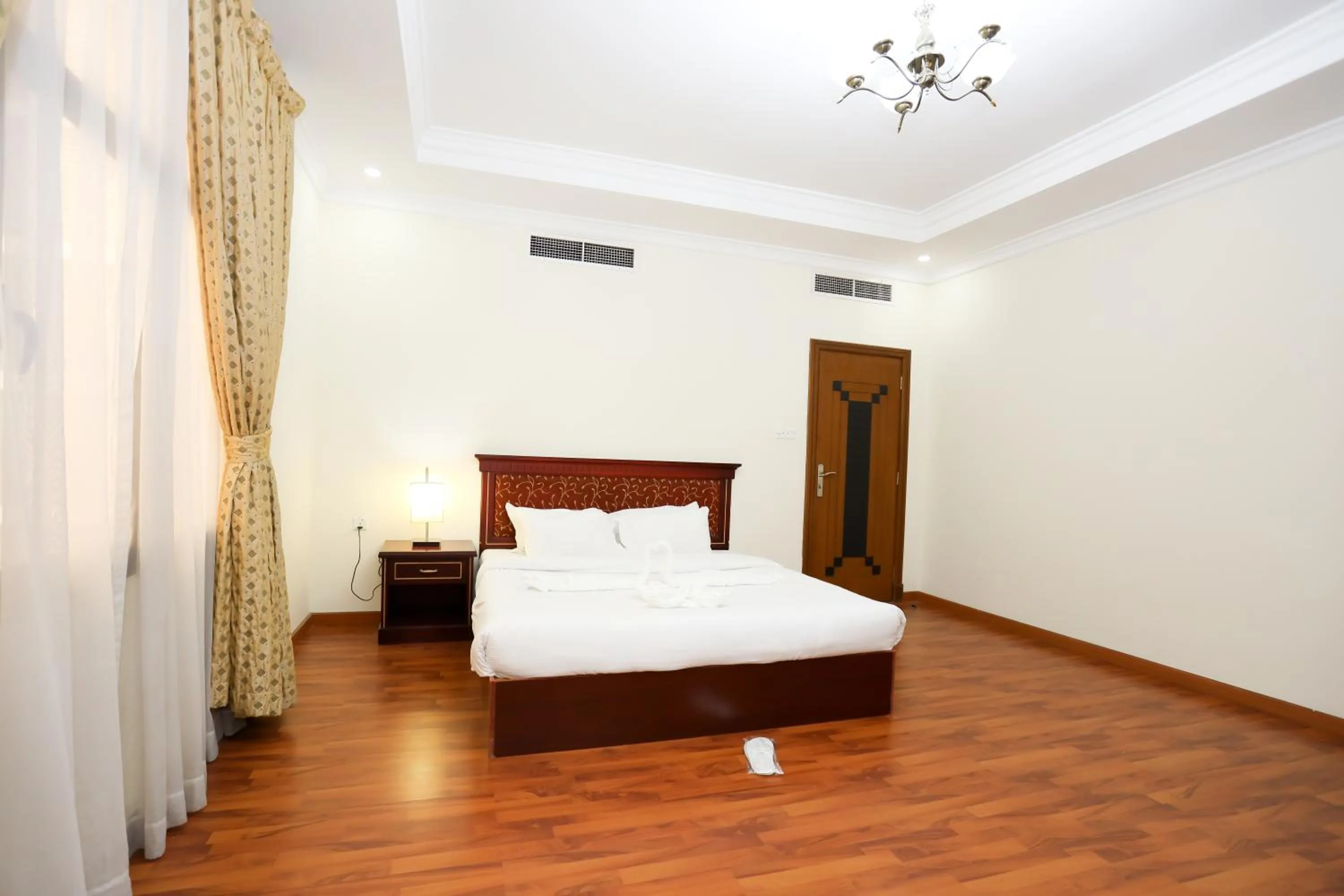 Bed in Pearl Bahrain Suites