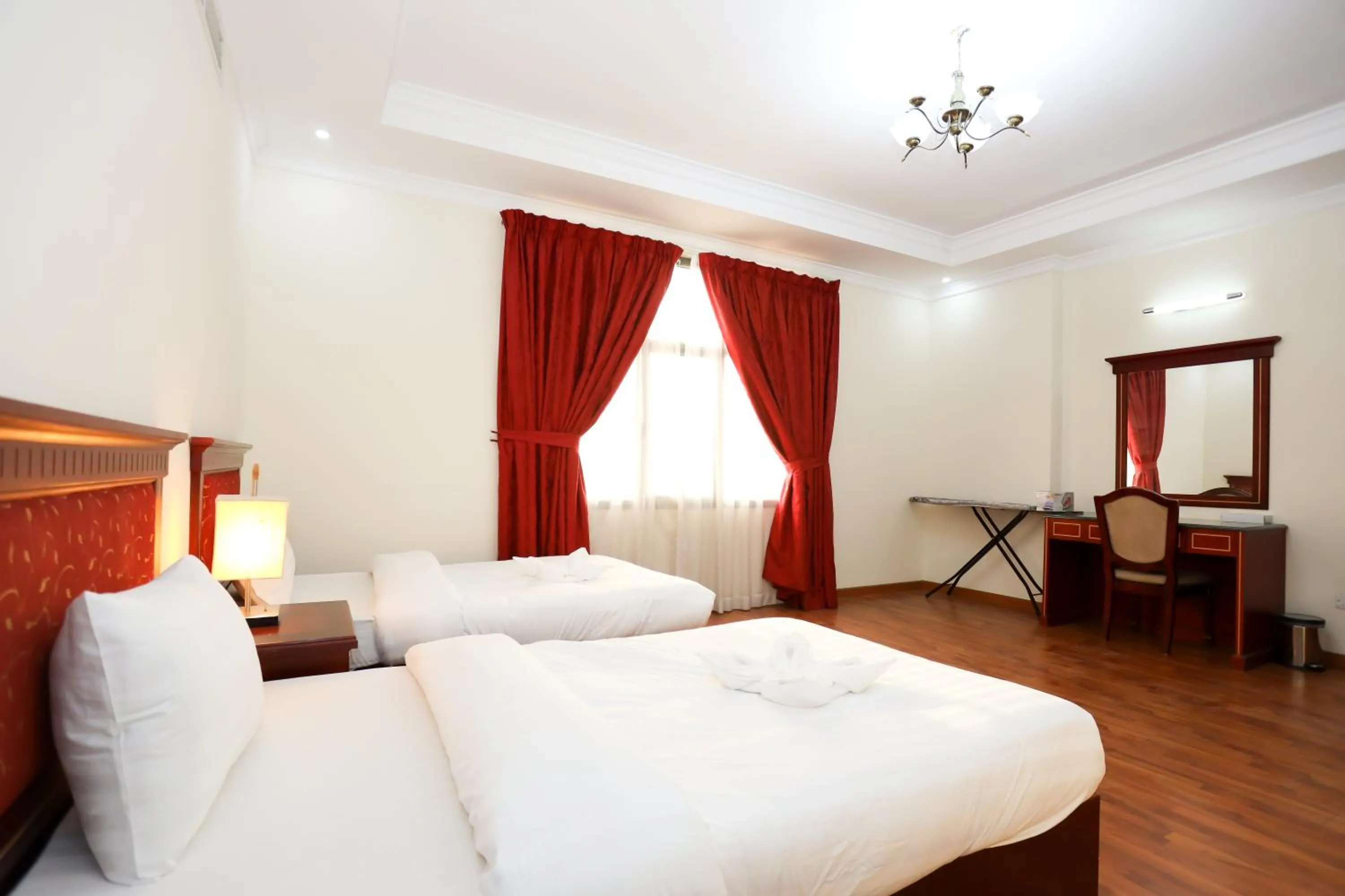 Bed in Pearl Bahrain Suites