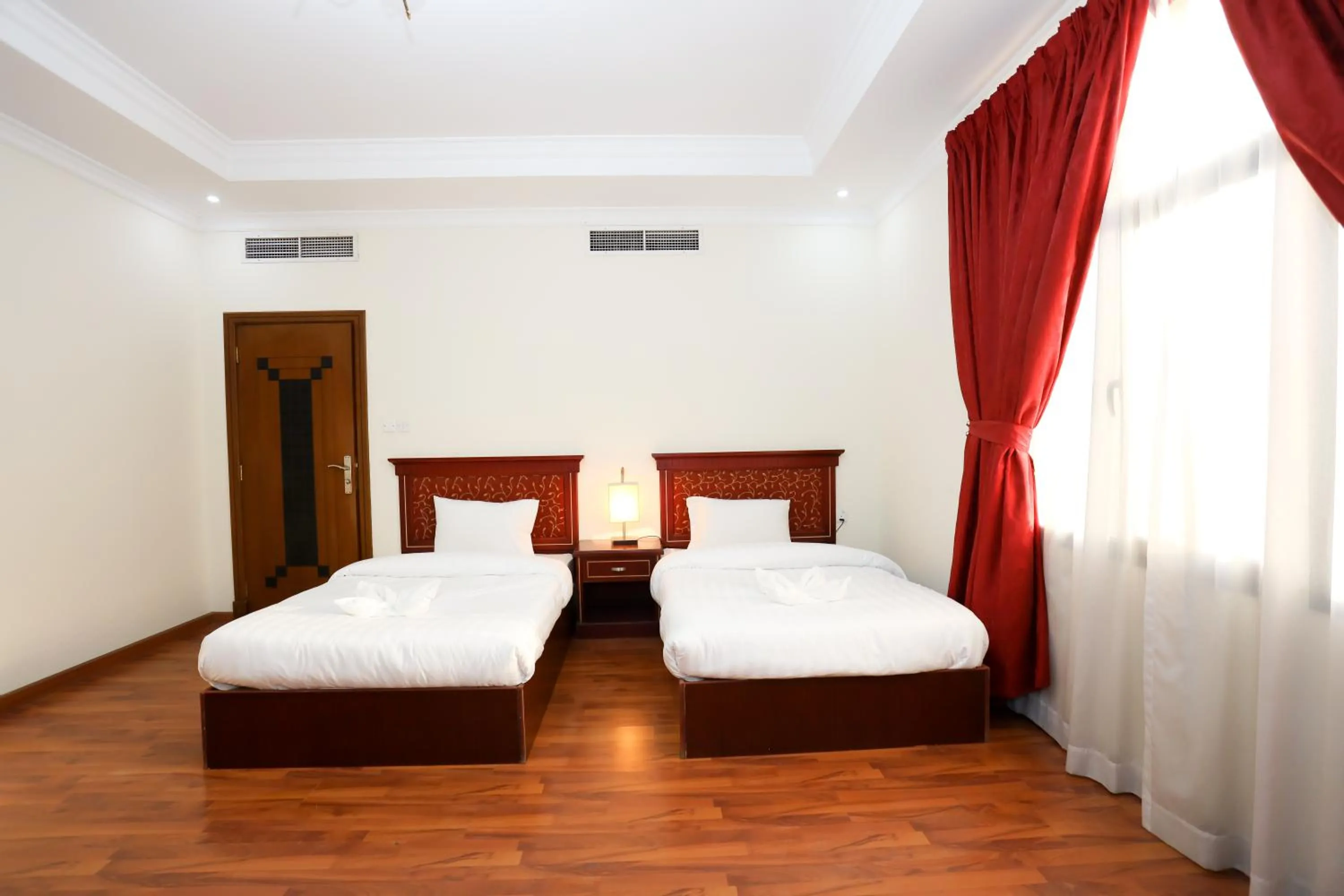 Bed in Pearl Bahrain Suites