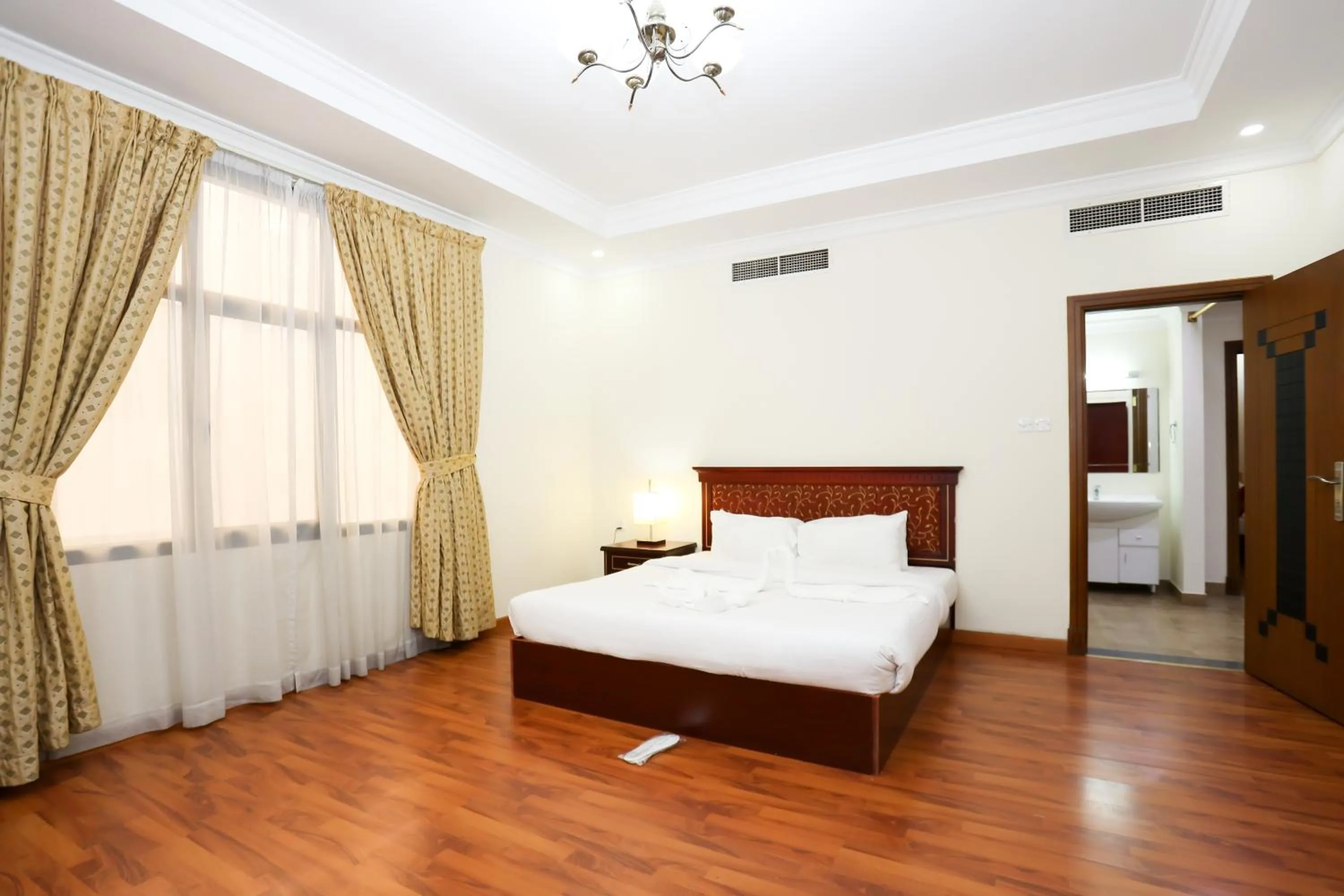 Bed in Pearl Bahrain Suites