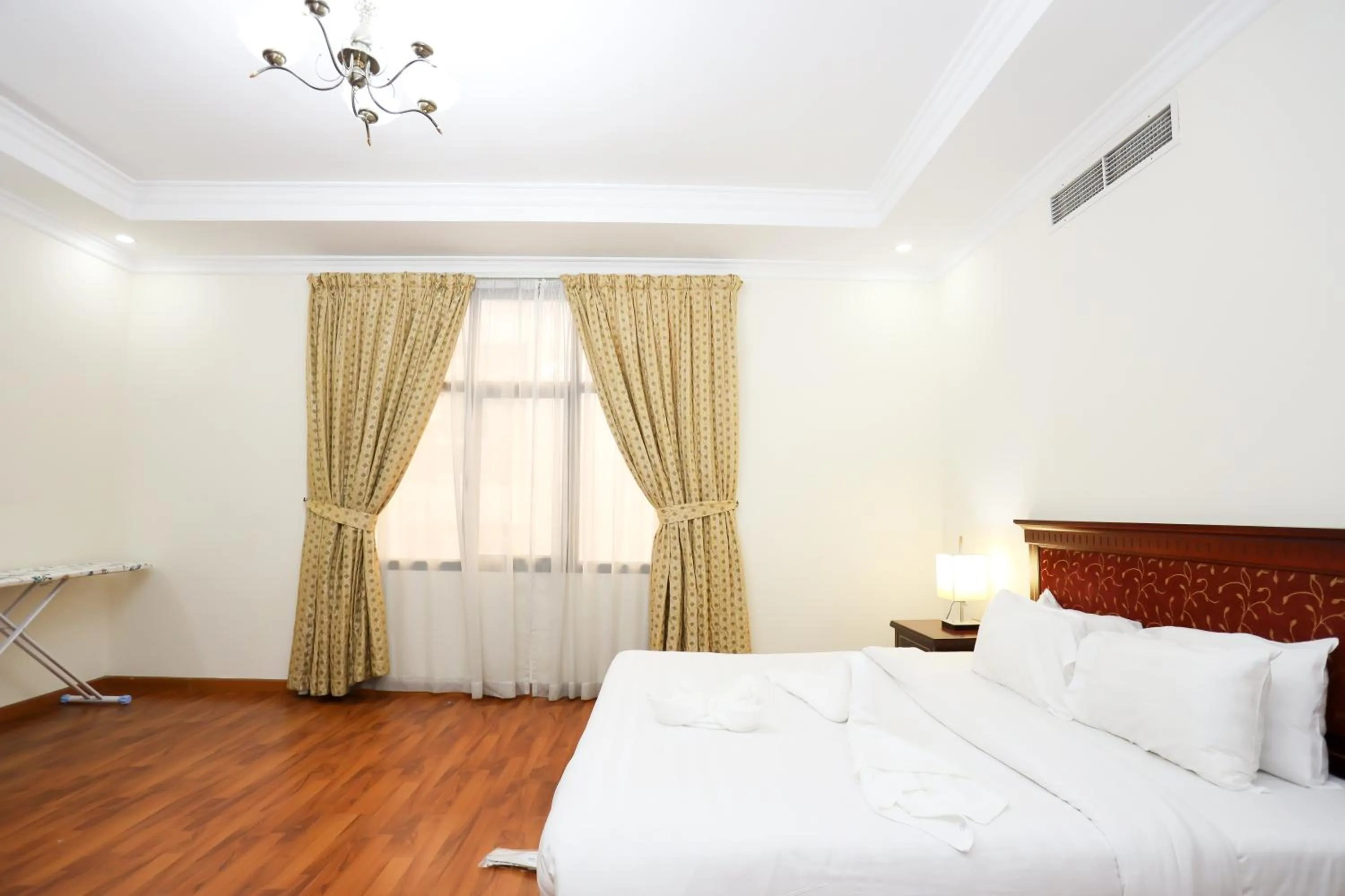 Bed in Pearl Bahrain Suites