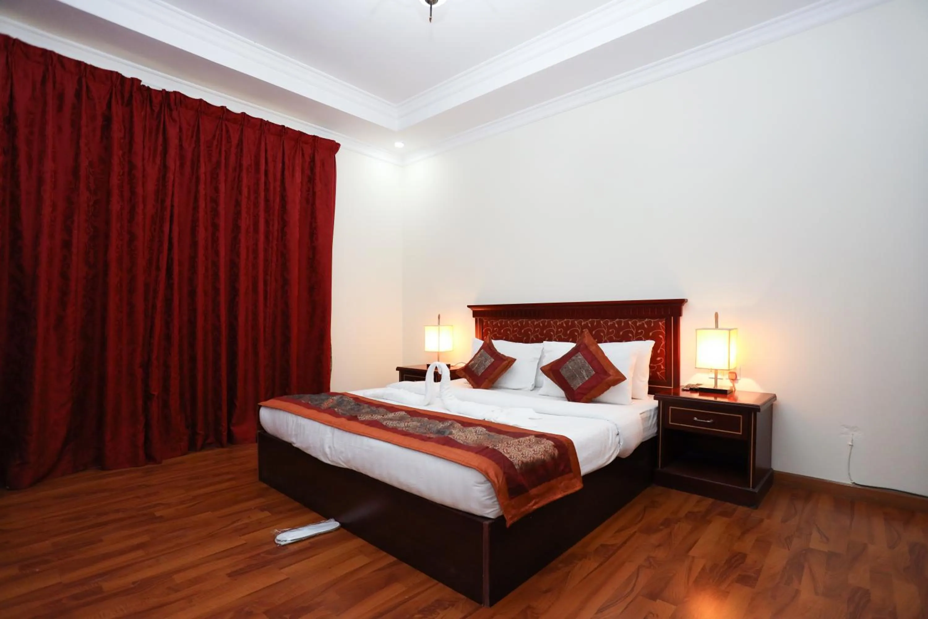 Bed in Pearl Bahrain Suites