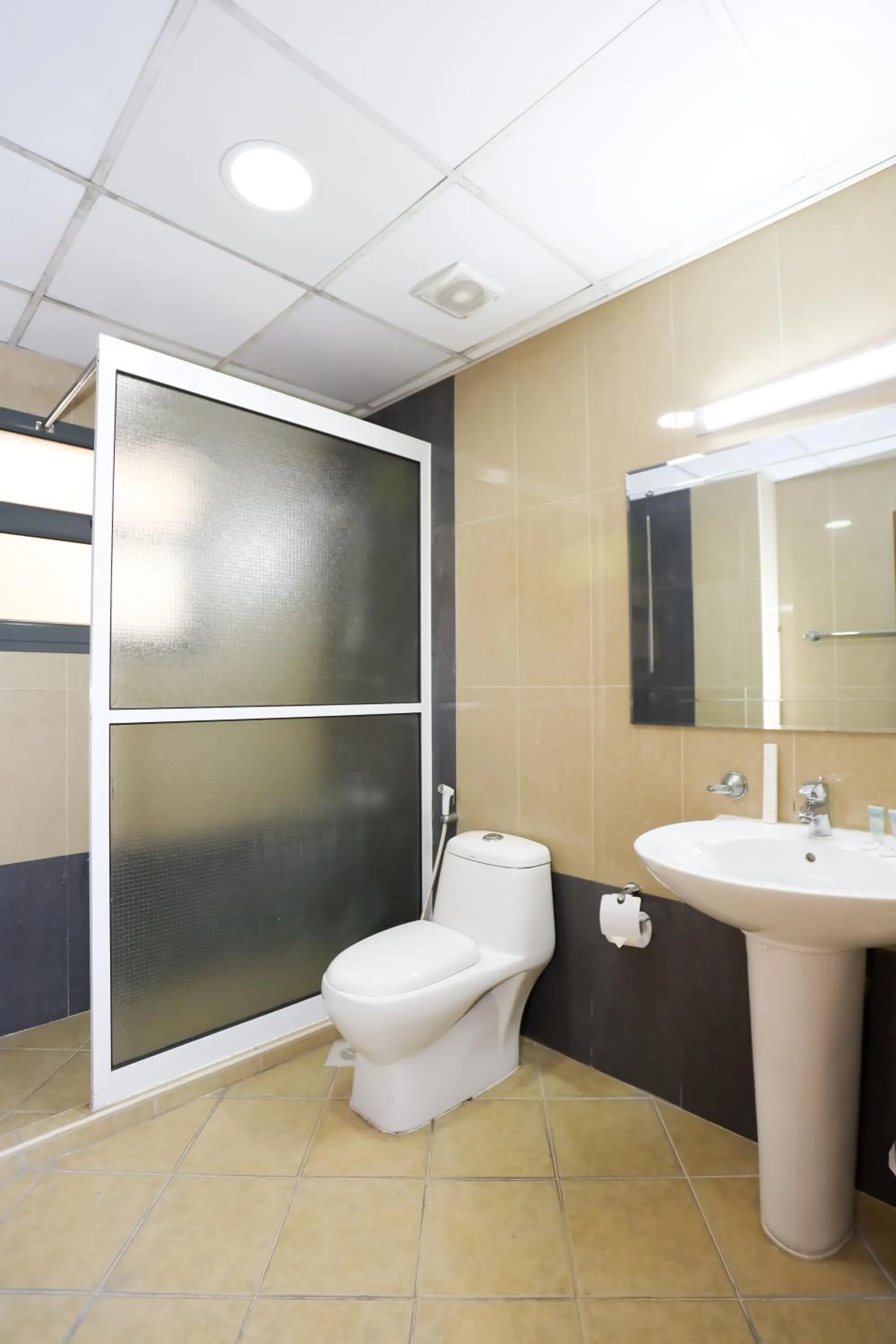 Toilet in Pearl Bahrain Suites