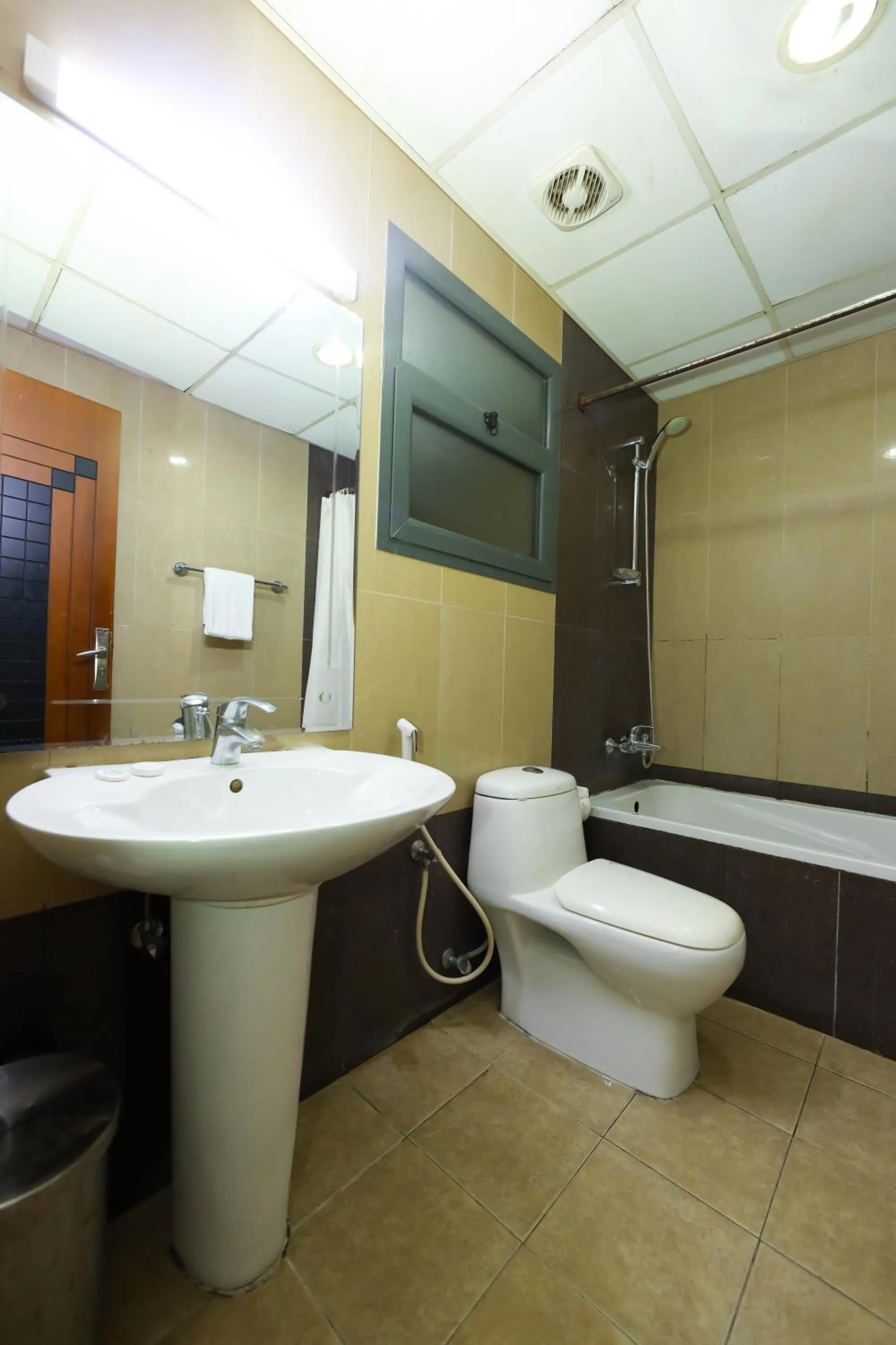 Toilet in Pearl Bahrain Suites
