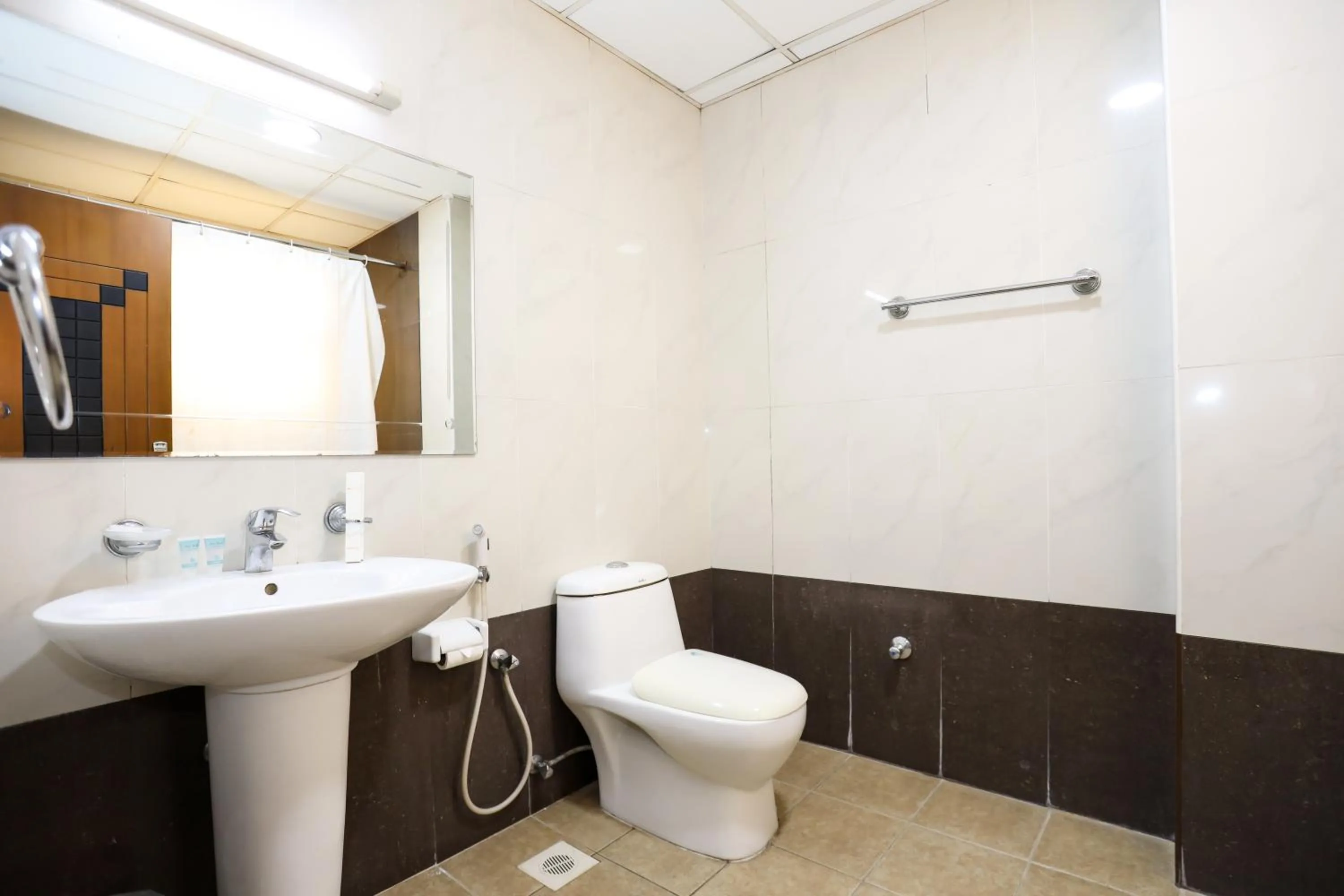 Toilet in Pearl Bahrain Suites