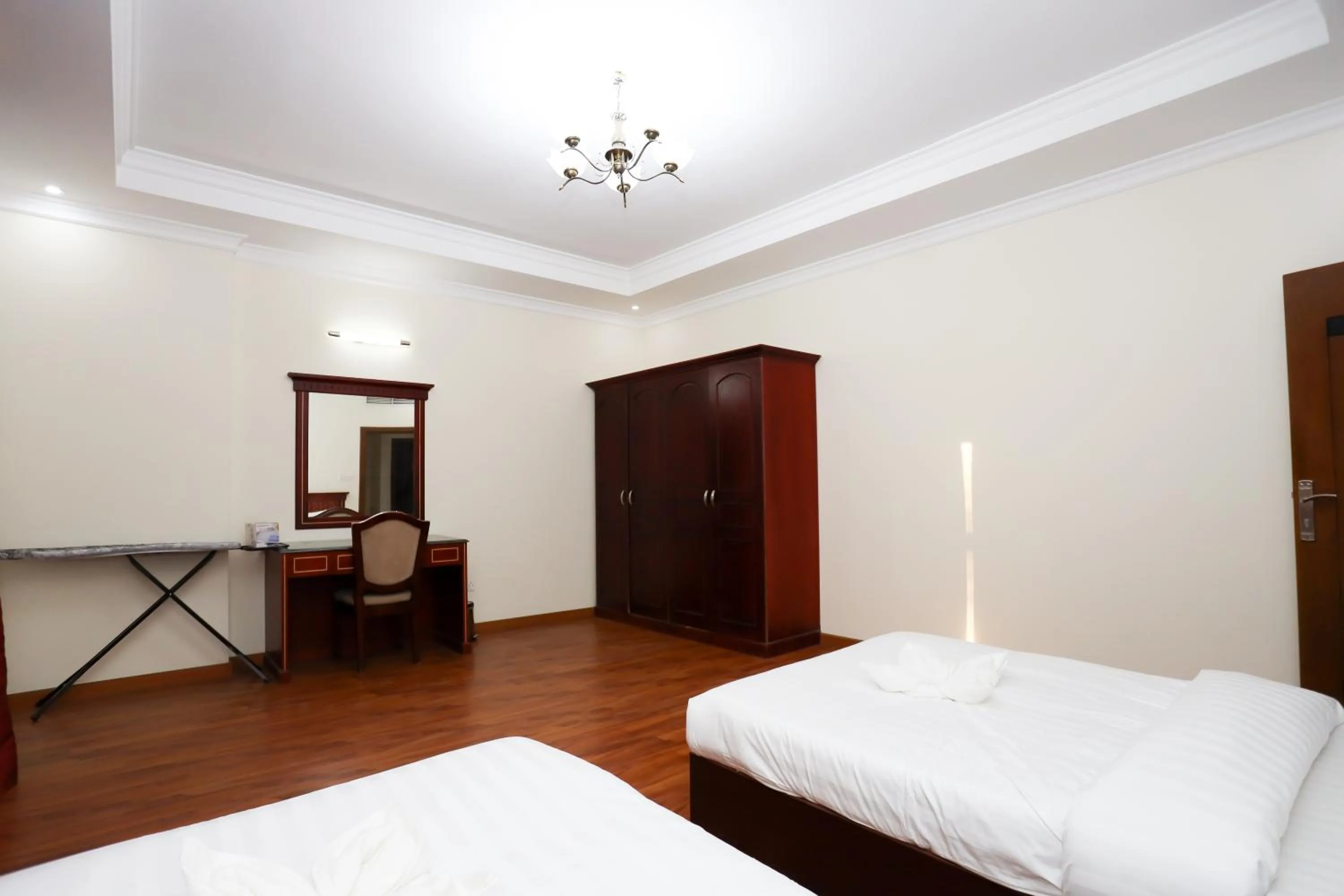 Bed in Pearl Bahrain Suites