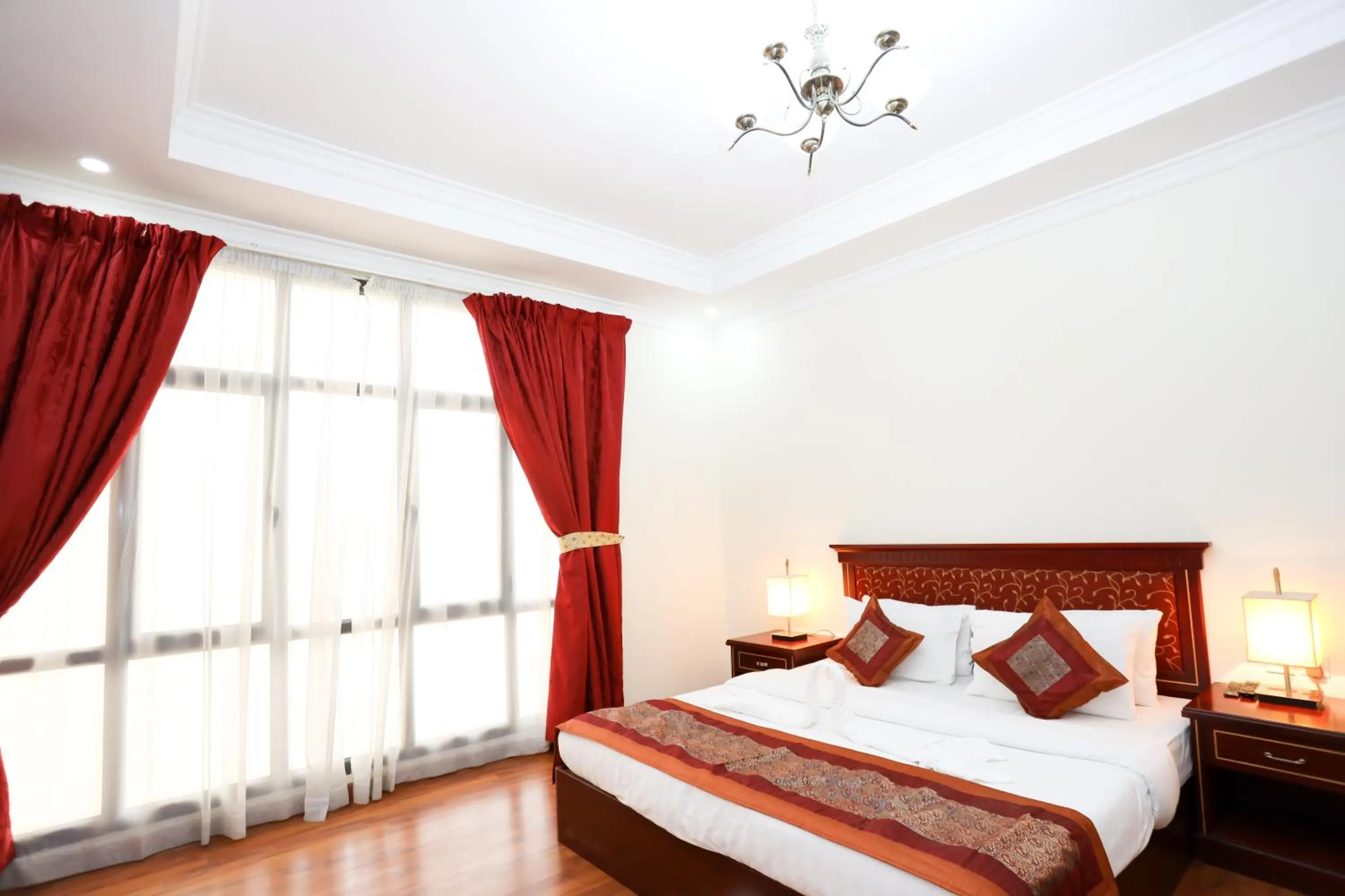 Bed in Pearl Bahrain Suites