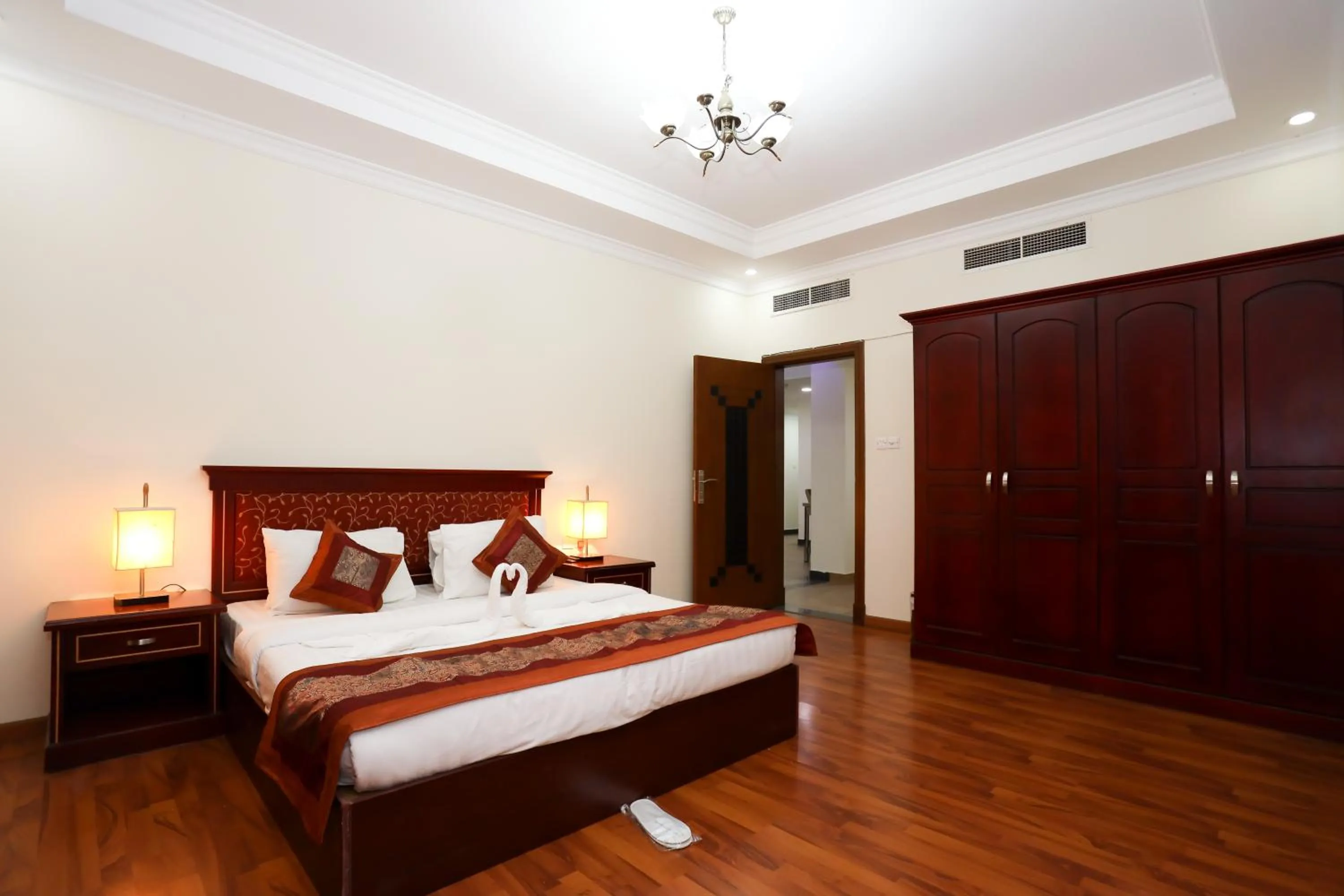 Bed in Pearl Bahrain Suites