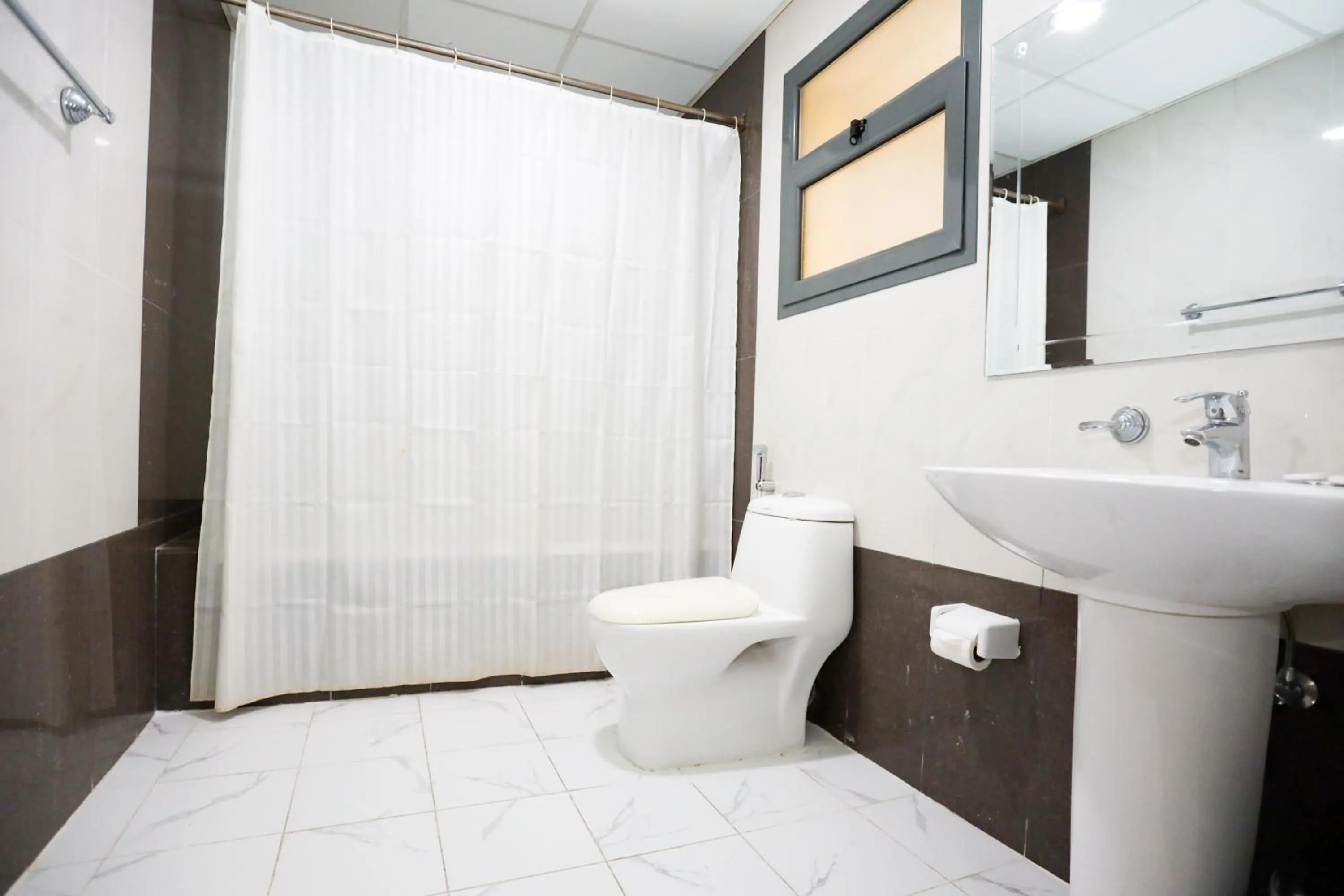 Toilet in Pearl Bahrain Suites