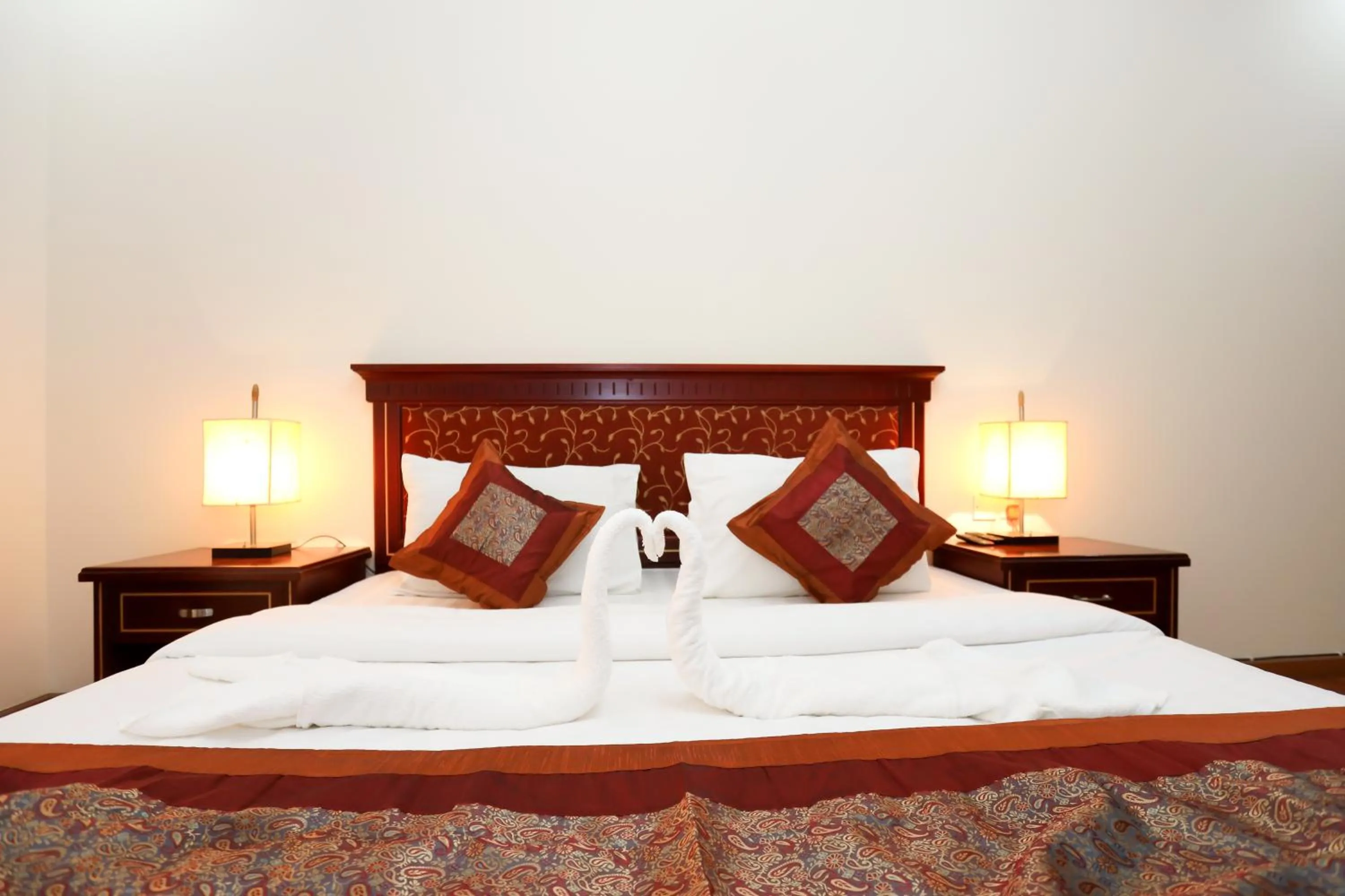Bed in Pearl Bahrain Suites