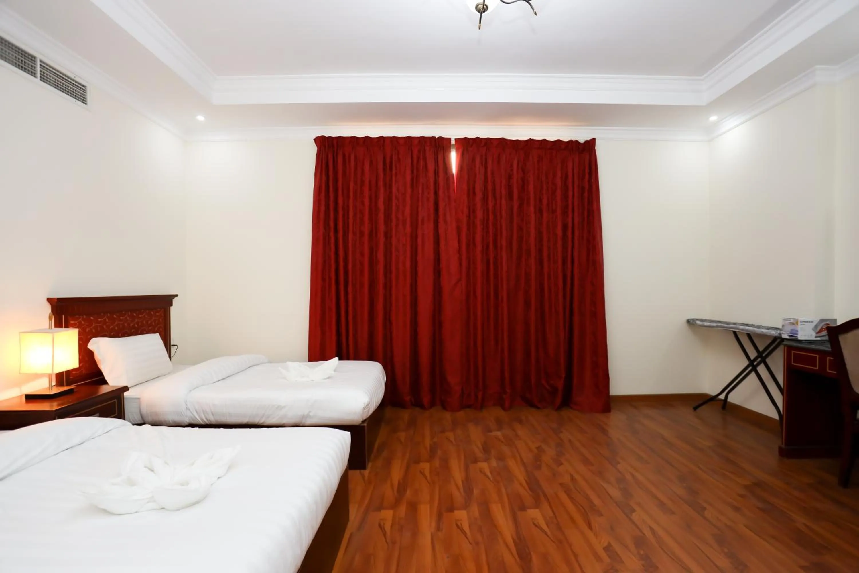 Bed in Pearl Bahrain Suites