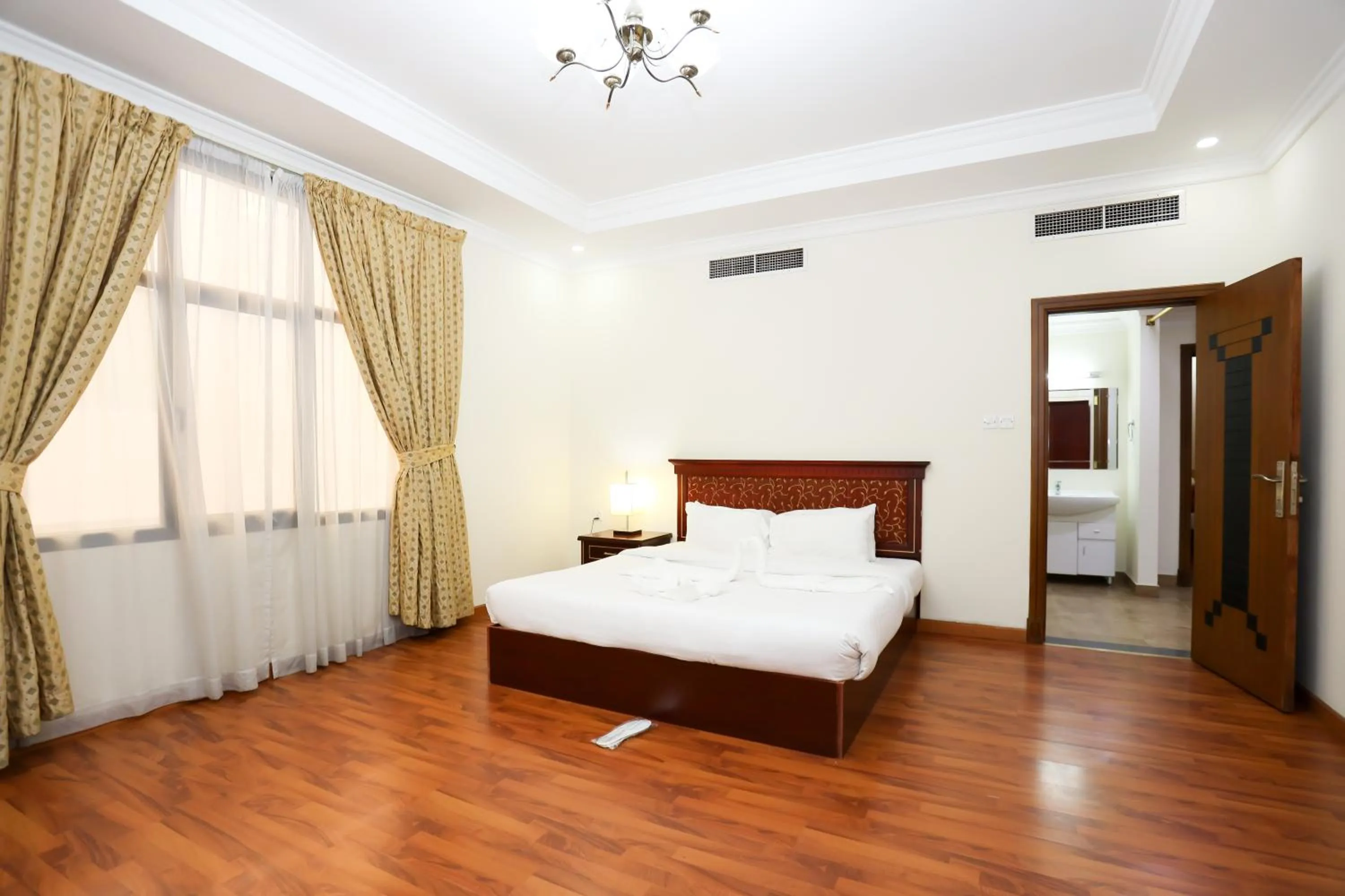 Bed in Pearl Bahrain Suites