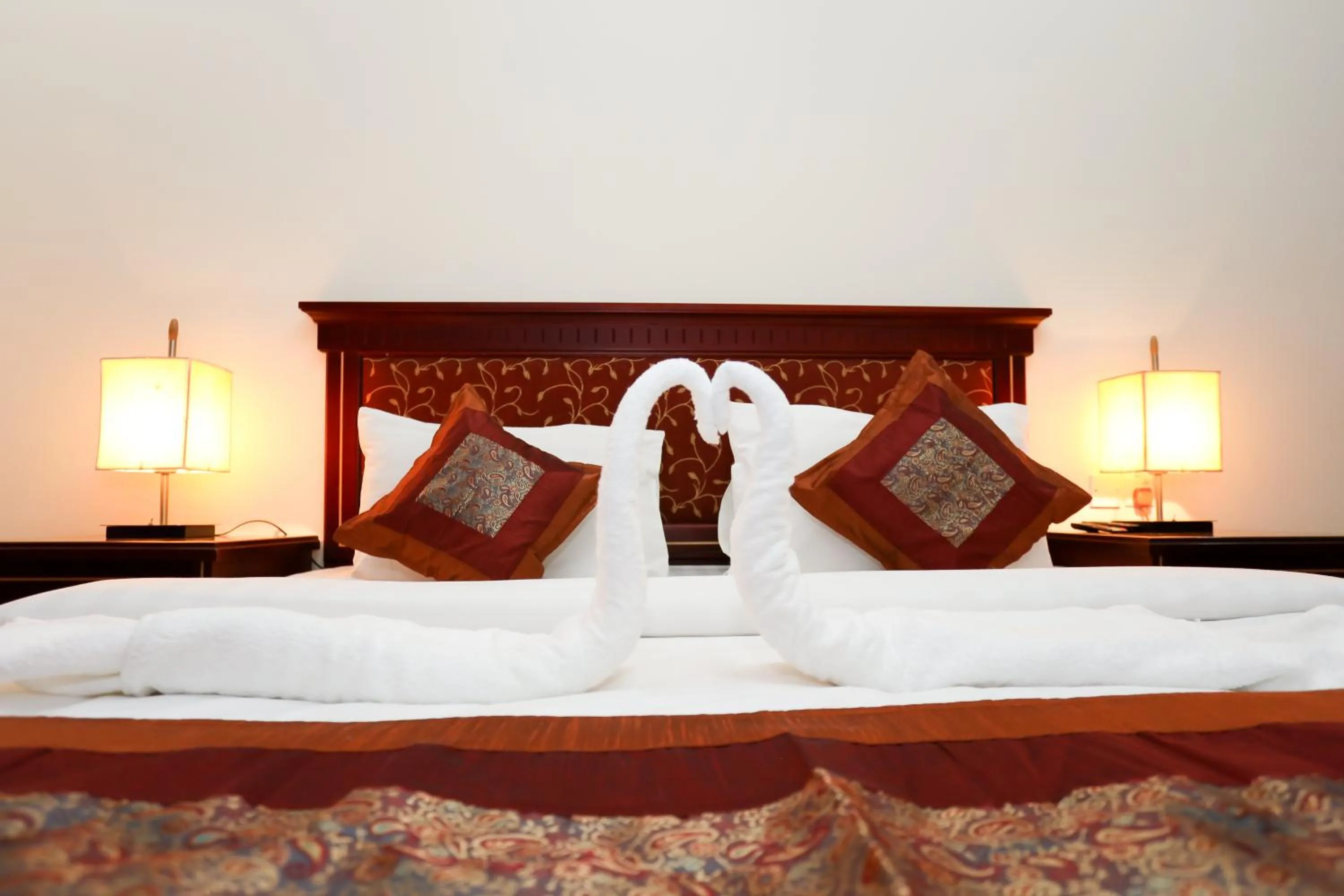 Bed in Pearl Bahrain Suites