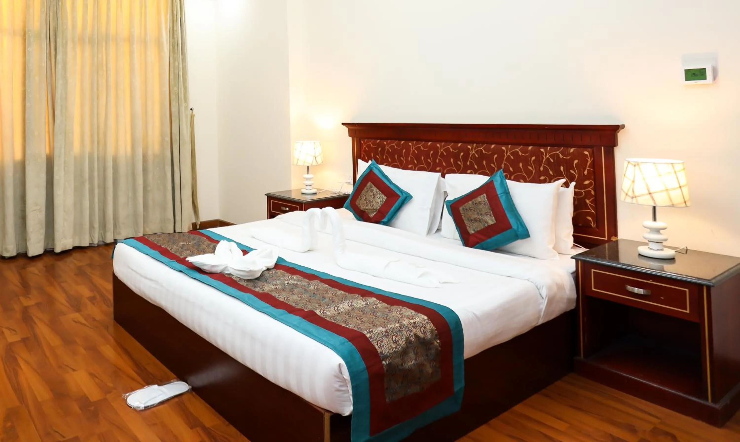 Bed in Pearl Bahrain Suites