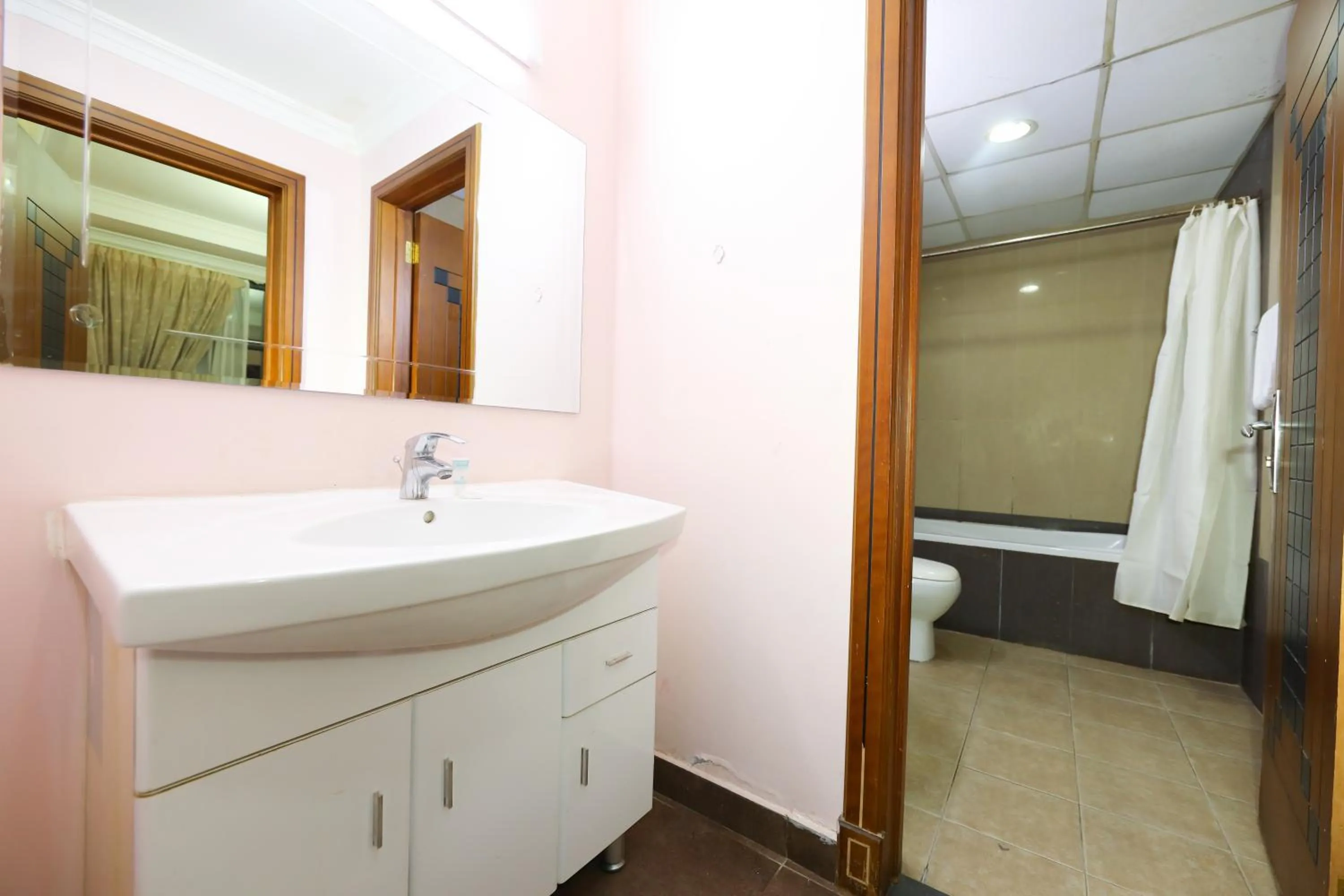 Toilet in Pearl Bahrain Suites