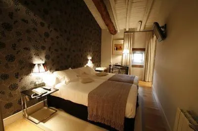 Bed in Hotel Palacio Muñatones