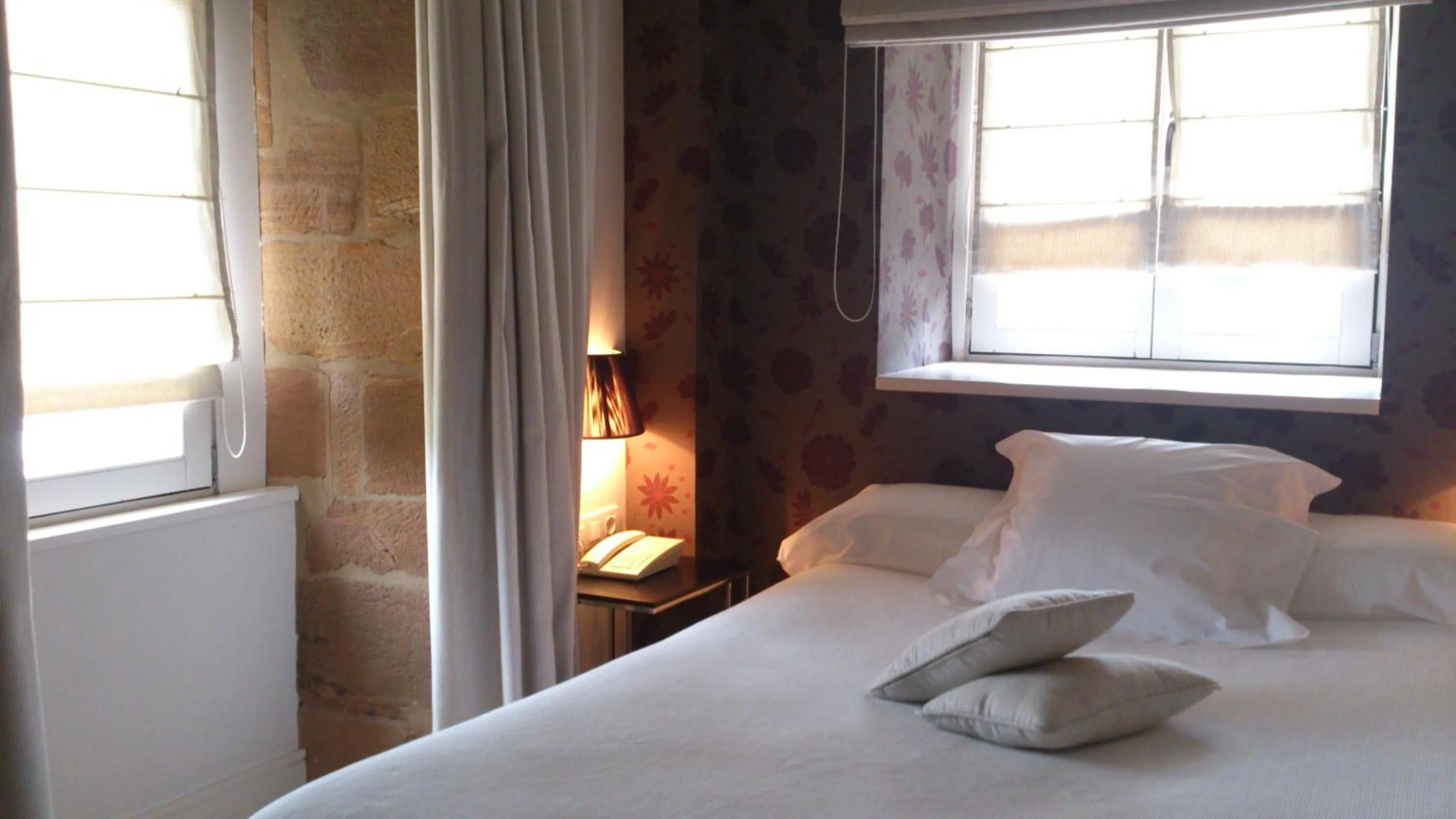 Bed in Hotel Palacio Muñatones