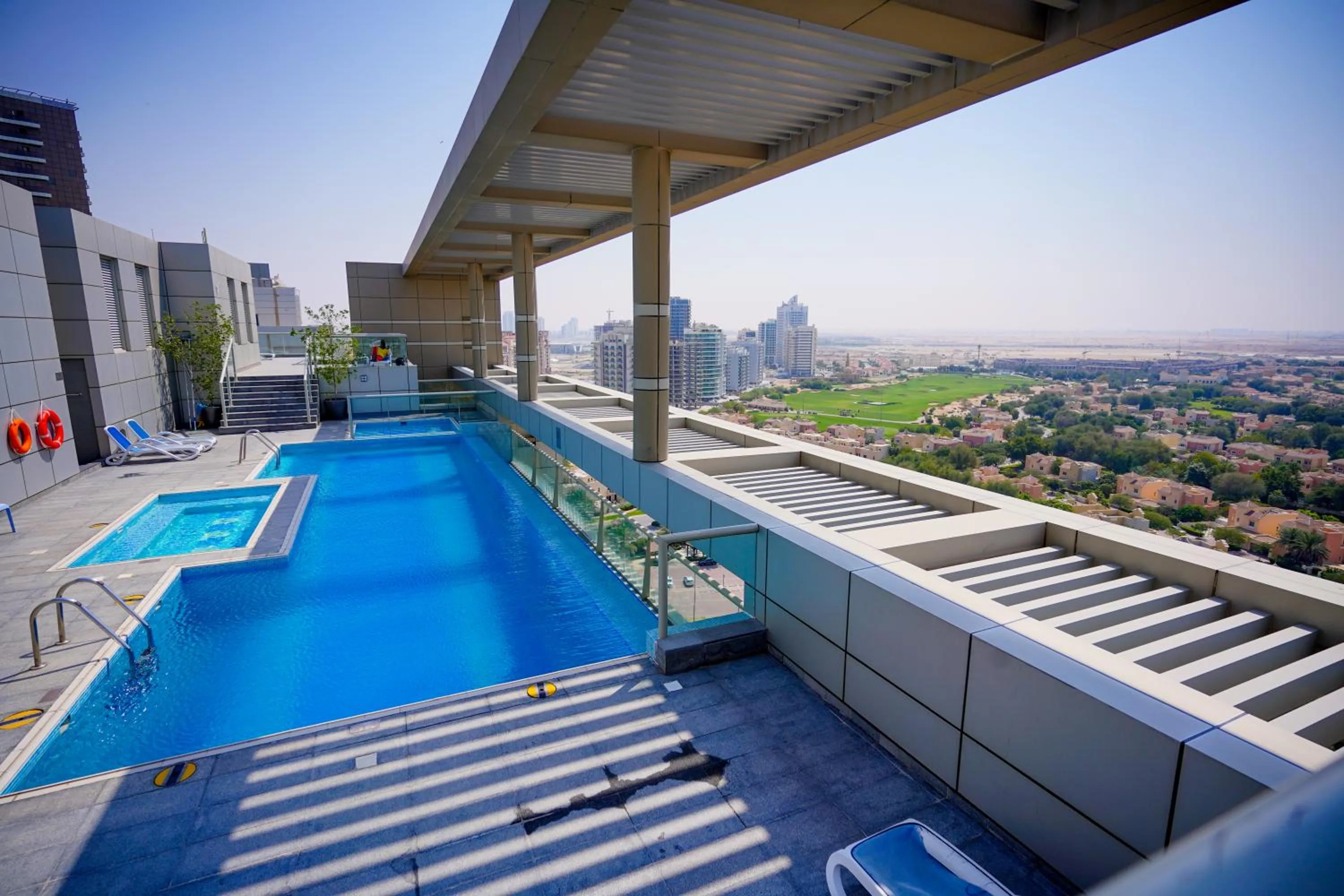 Swimming pool in Unique 1BR Apartment in Sport City