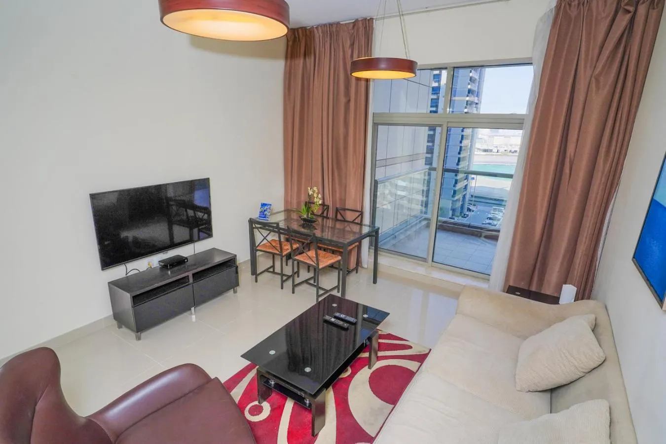 Communal lounge/ TV room in Unique 1BR Apartment in Sport City