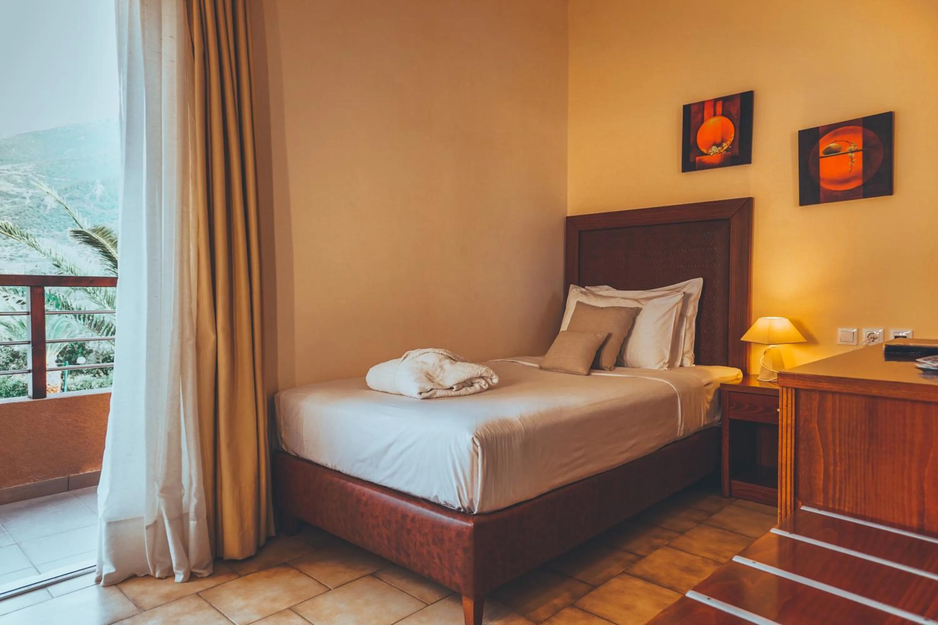 Bed in Apollo Resort Art Hotel