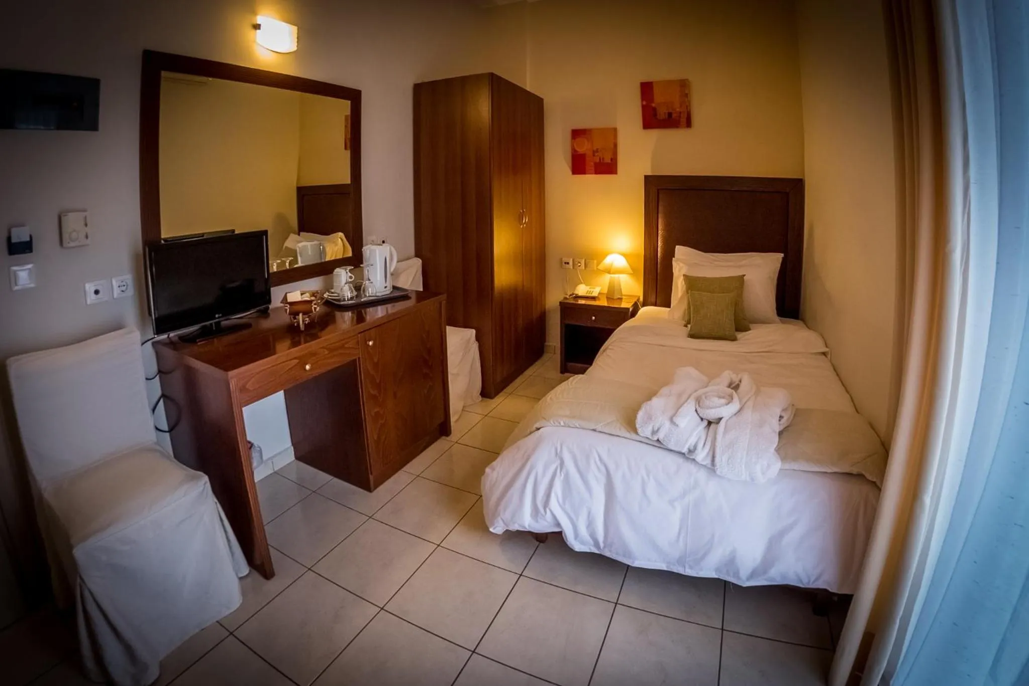 Bed in Apollo Resort Art Hotel