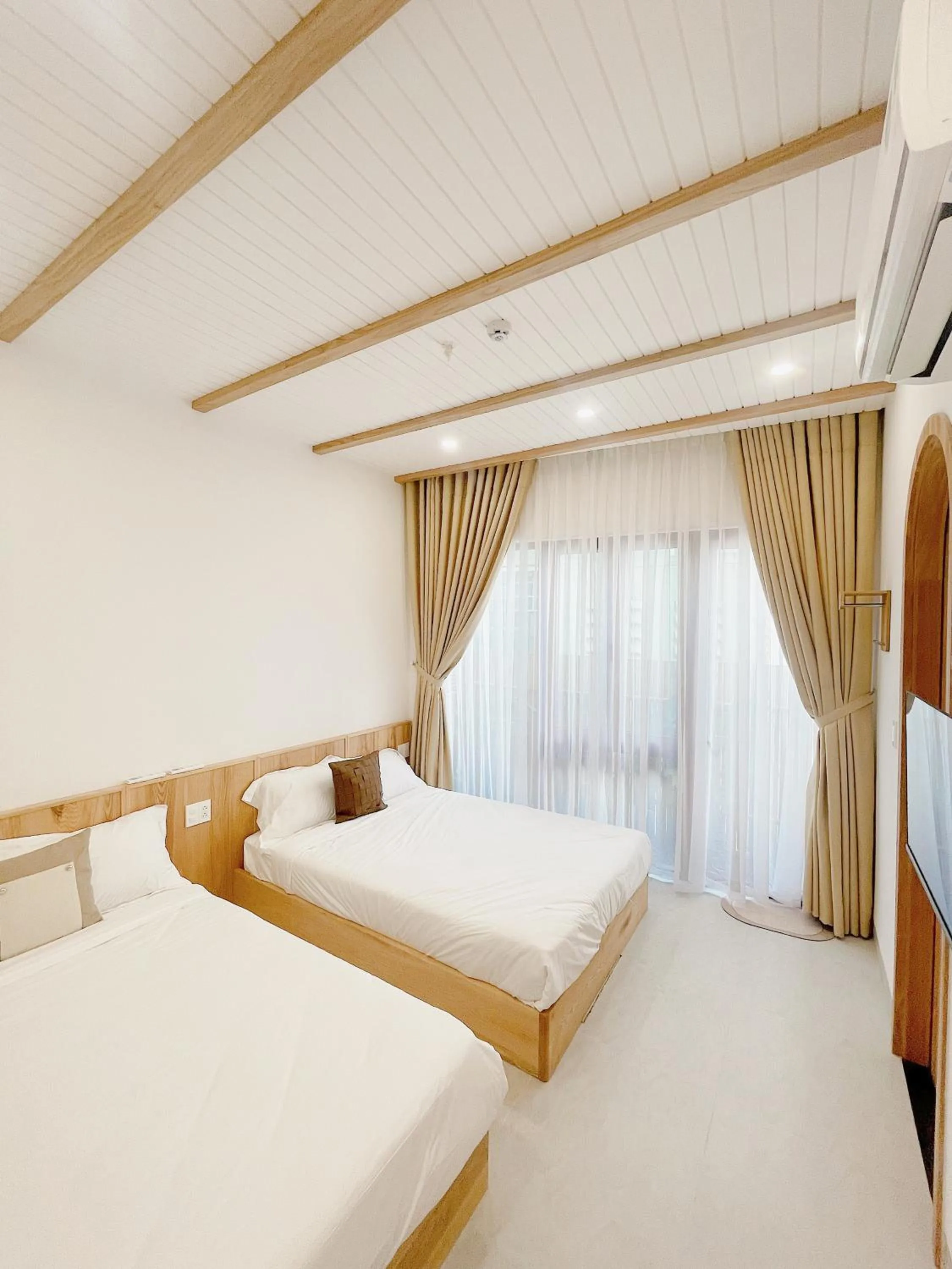 Bedroom, Bed in Baphu Beachwalk Apartment - 5 min walk to My Khe beach